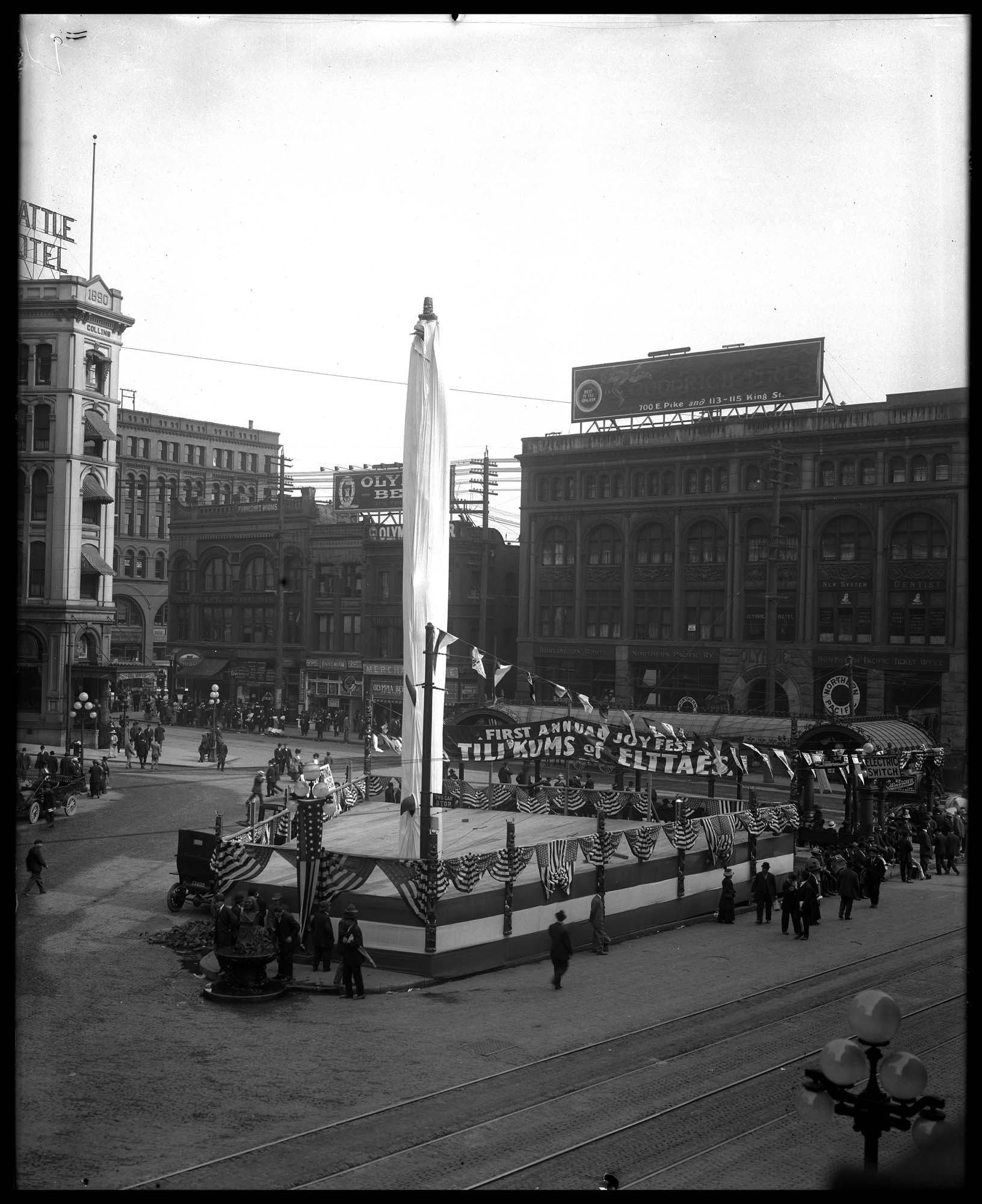 Image of Pioneer Square decorated for Potlatch, 1911