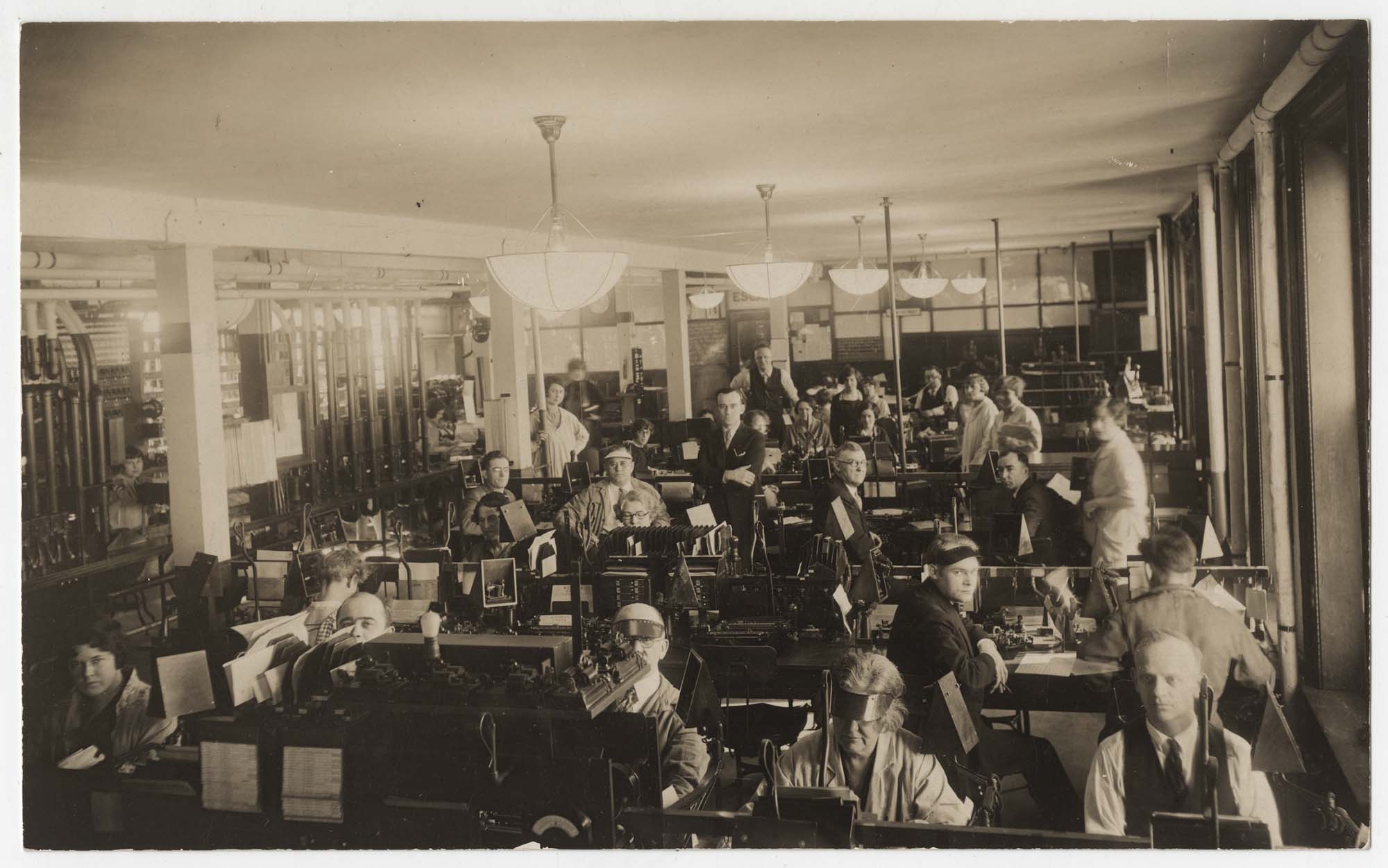 Image of Interior of Western Union telegraph office, circa 1920