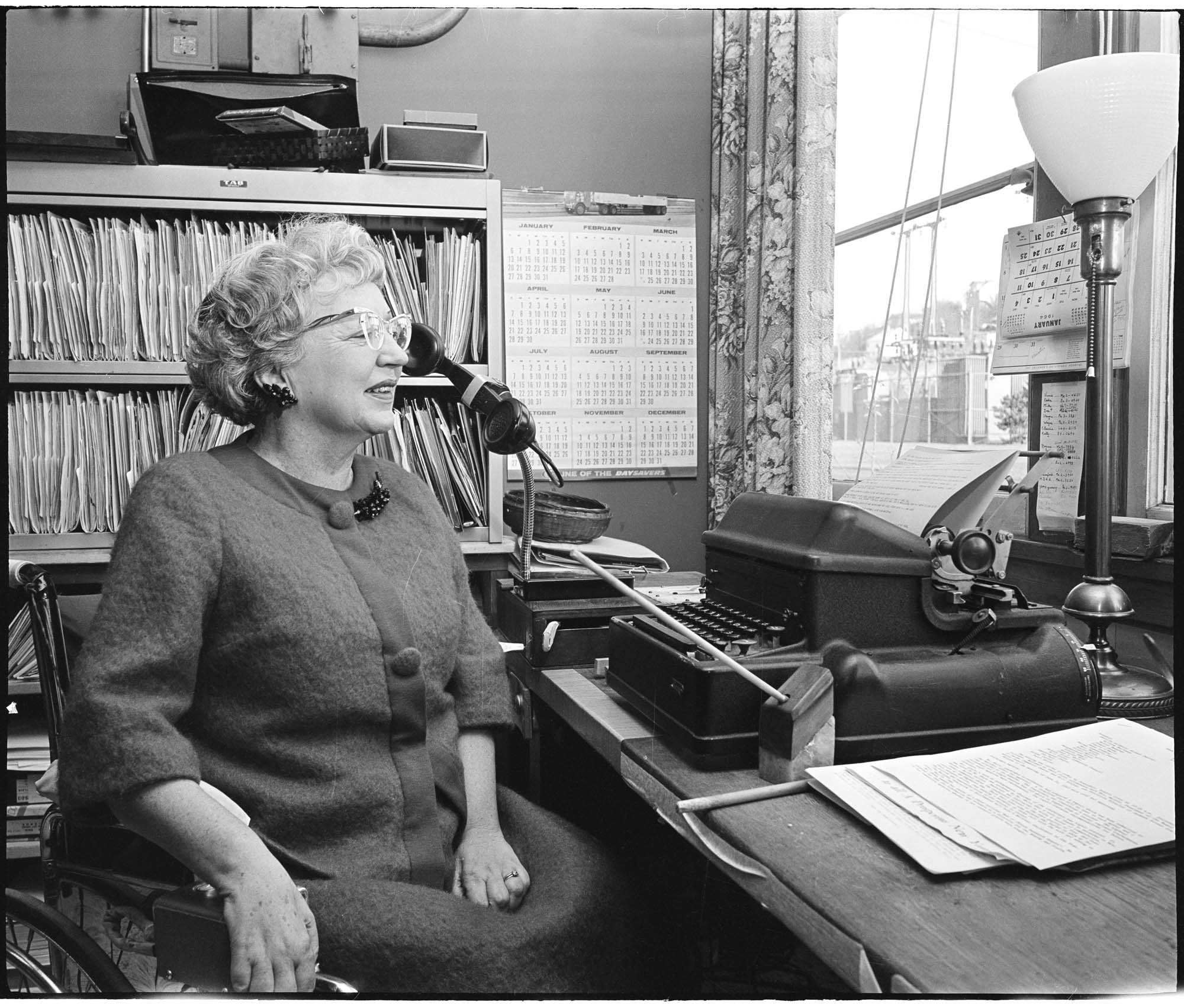 Image of Ida May Daly, director of the Handicapped Center, in her office, Seattle, November 1963