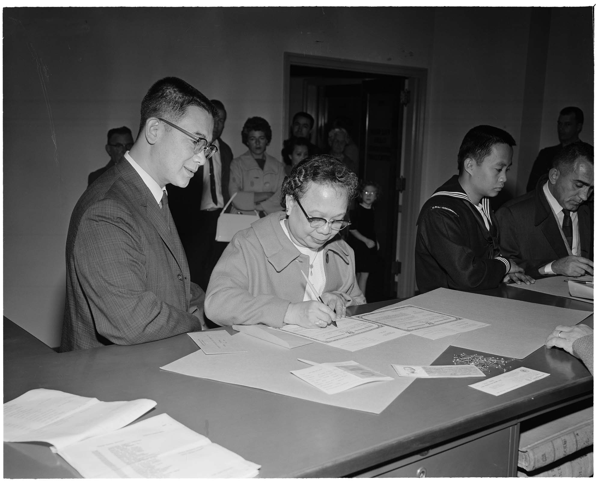 Image of Mrs. Lew Fung Hai Luke and her son Wing Luke at Federal Courthouse, Seattle,  October 21, 1963