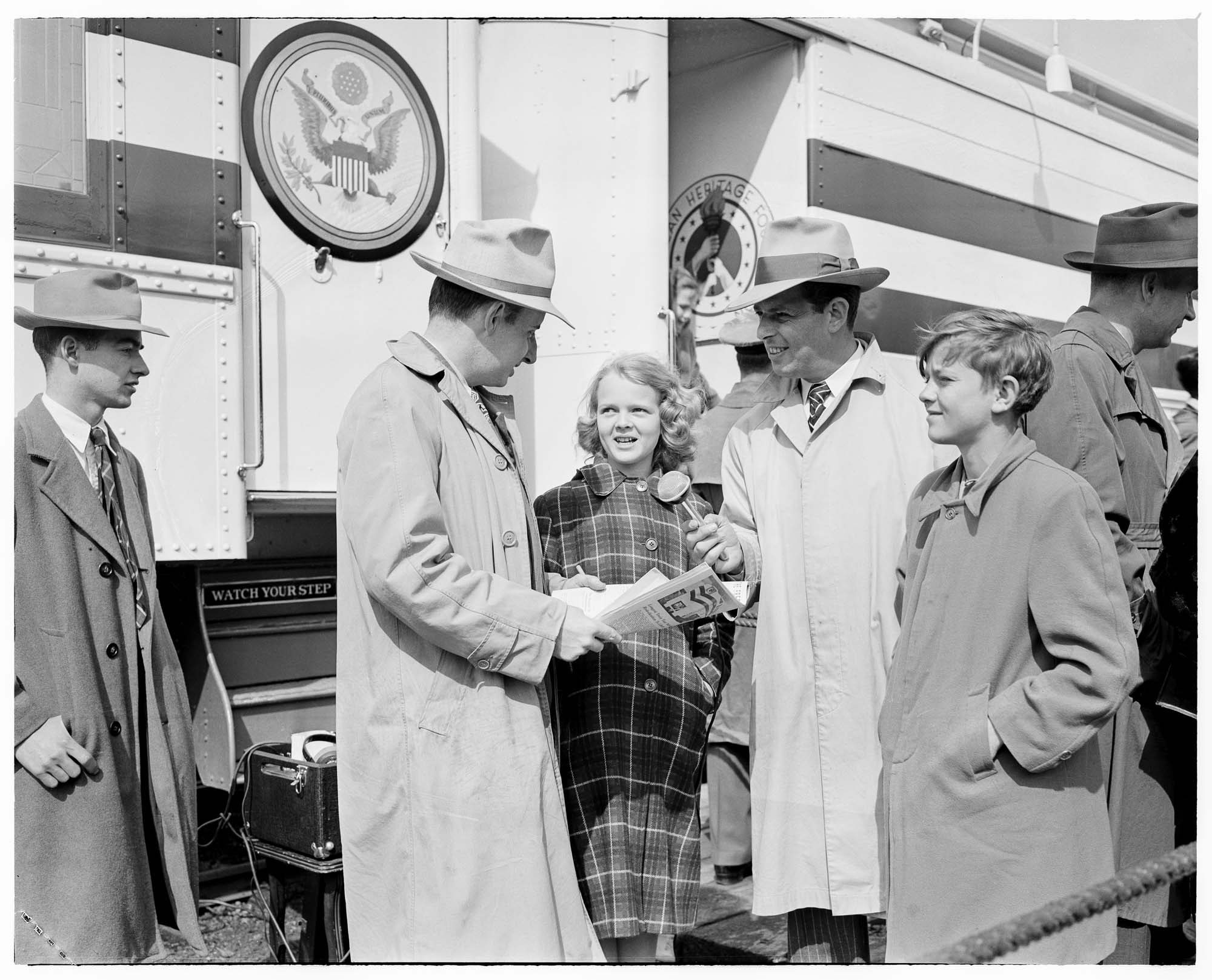 Image of Girl being interviewed in front of the Freedom Train at King Street Station, Seattle, 1948