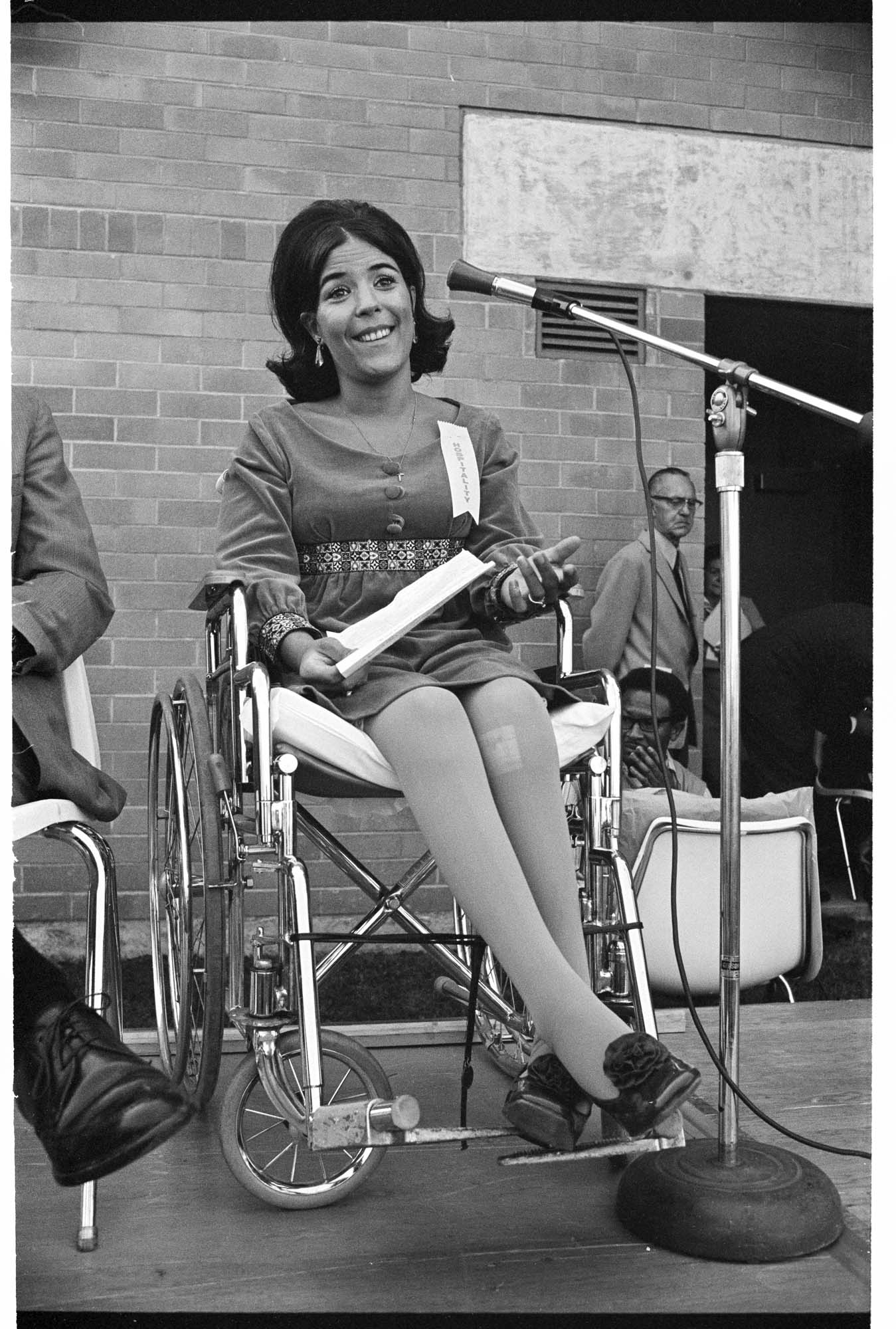 Image of Kathe Young speaking at dedication of Park Center Apartments for people with disabilities, Seattle, August 30, 1970