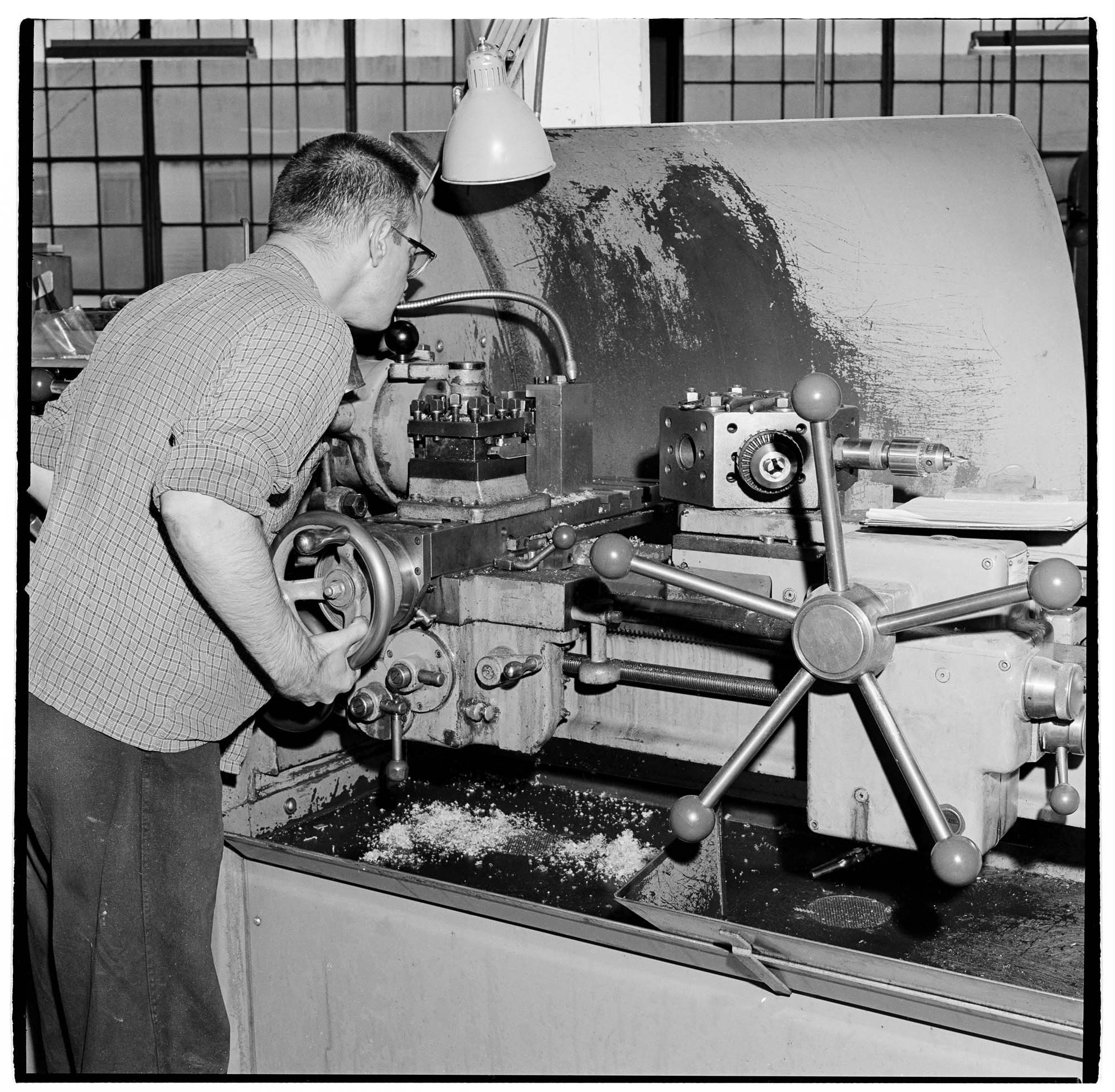 Image of Worker with a disability operating machinery at Occupational Rehabilitation, Inc., Seattle, November 1966