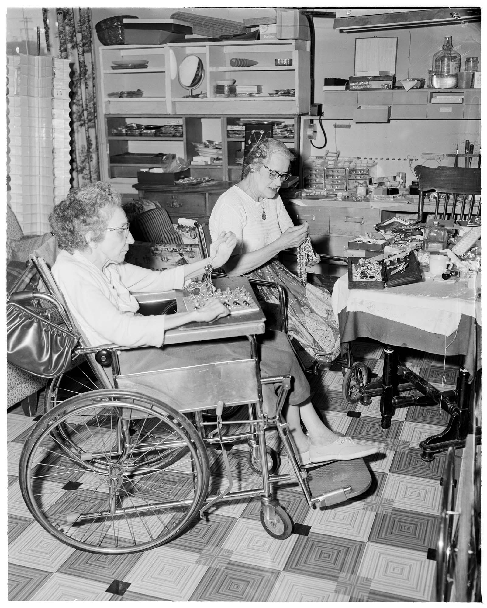 Image of Two women making jewelry for the Handicapped Center Christmas Bazaar, Seattle, November 8, 1962