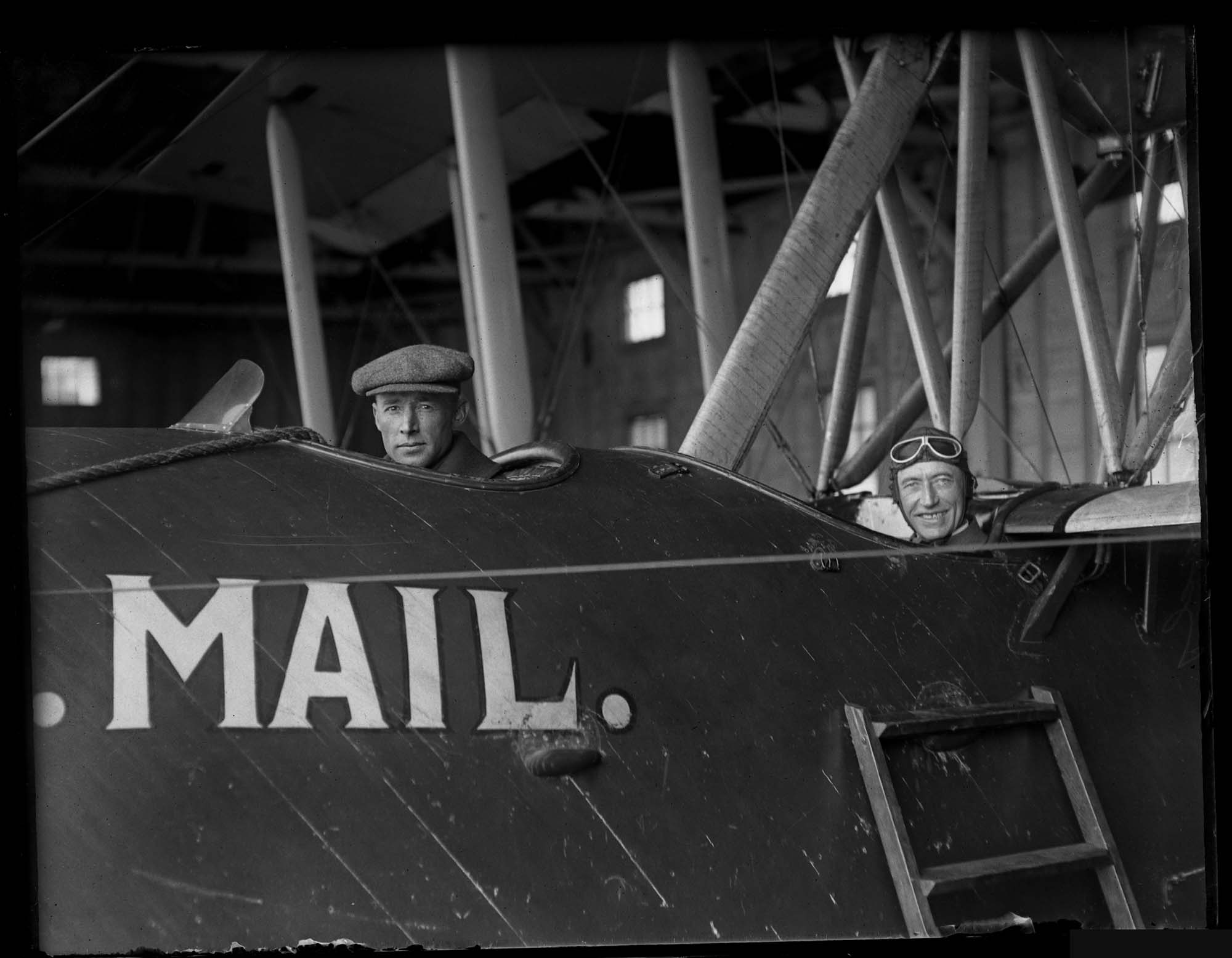 Image of Eddie Hubbard and unidentified man in mail plane, Seattle, circa 1919
