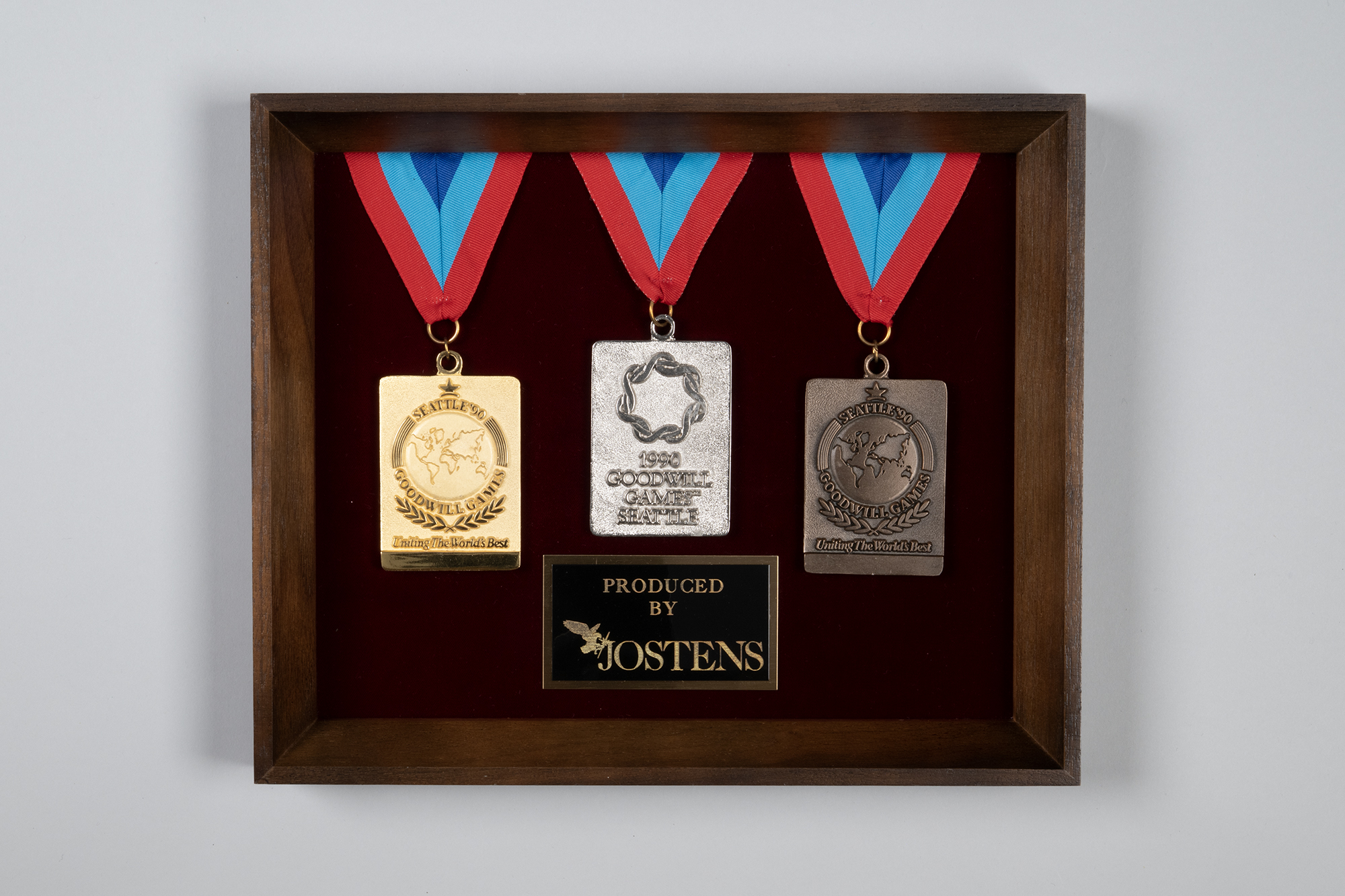 Image of Display set of medals made by Jostens for the Seattle Goodwill Games, 1990