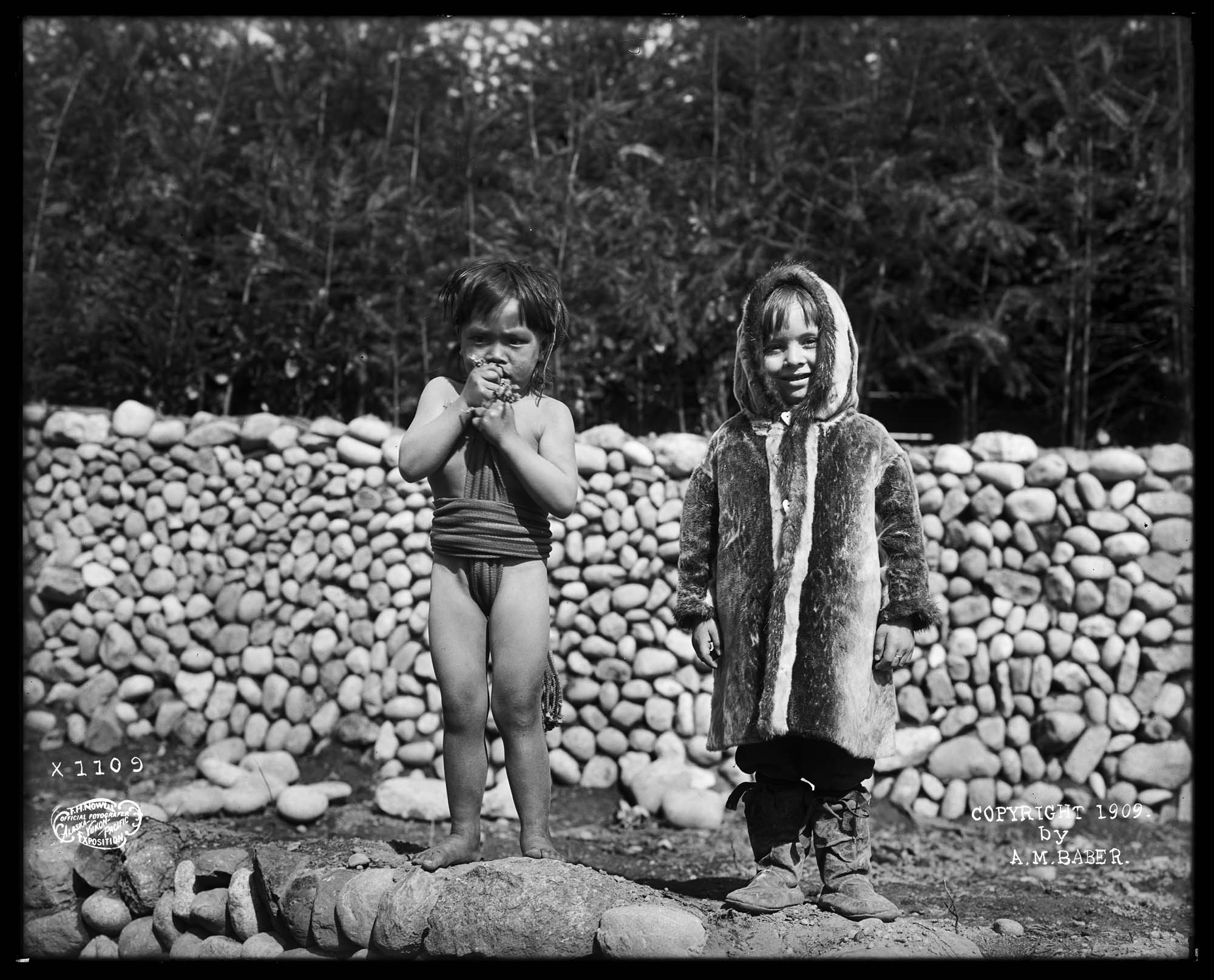 Image of Igorot child and Inuit child at Alaska-Yukon-Pacific Exposition, Seattle, 1909