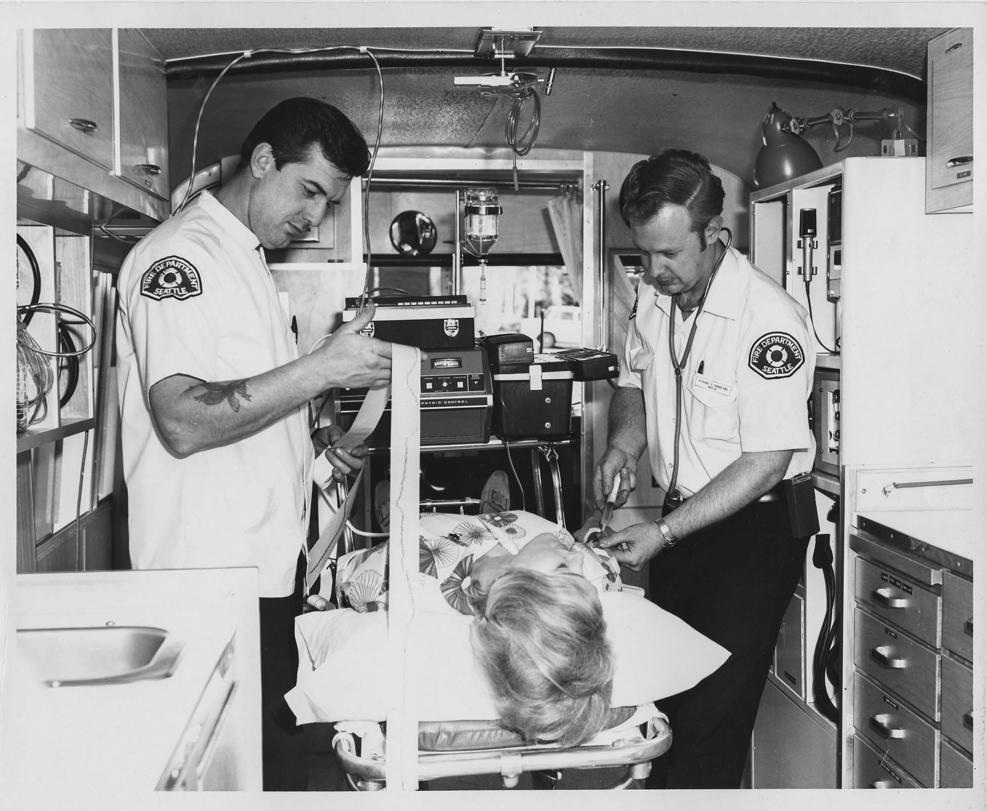 Image of Medics and patient model inside Medic One unit, Seattle, 1971