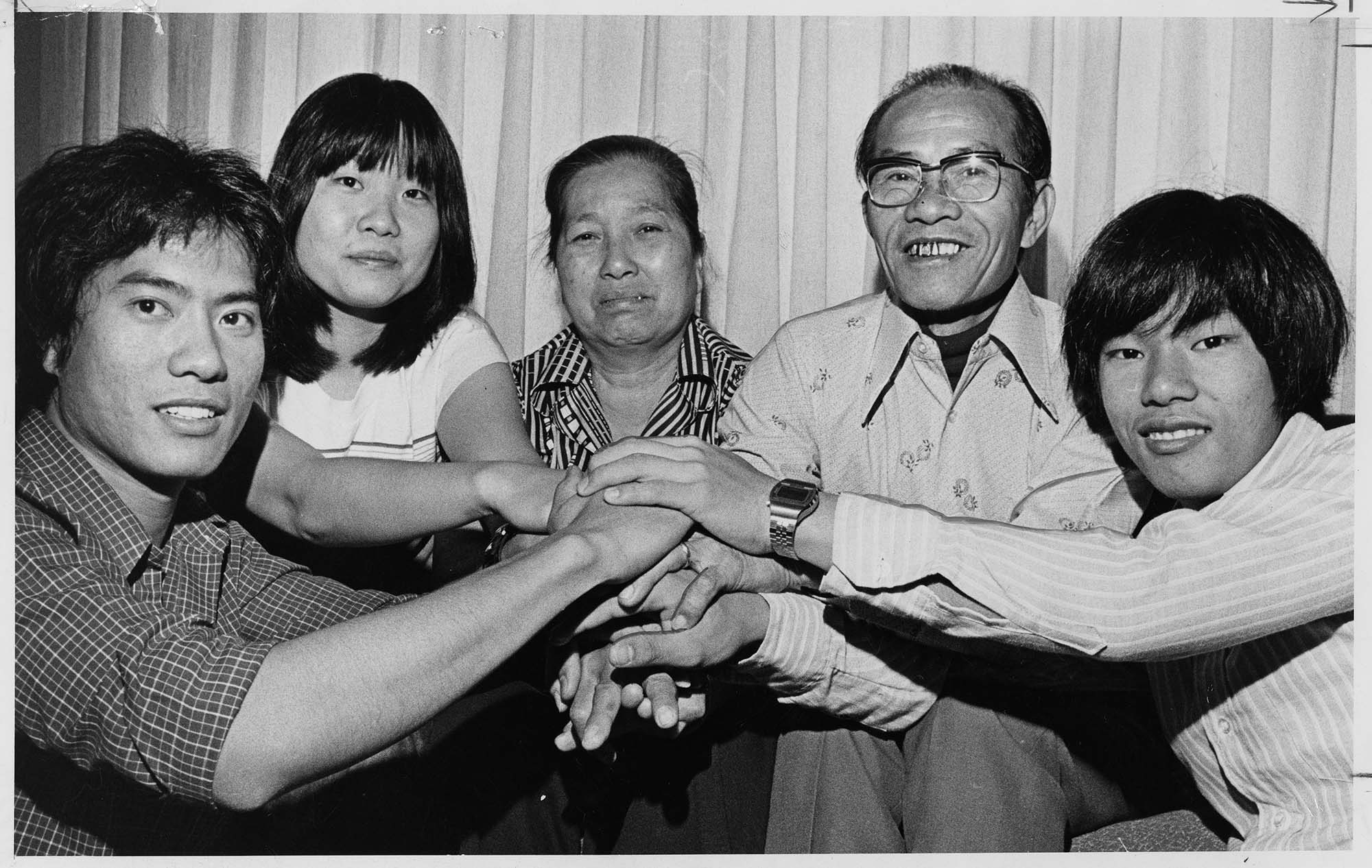 Image of Alexander Chau, left, welcomes his family from Vietnam, Seattle, July 16, 1977