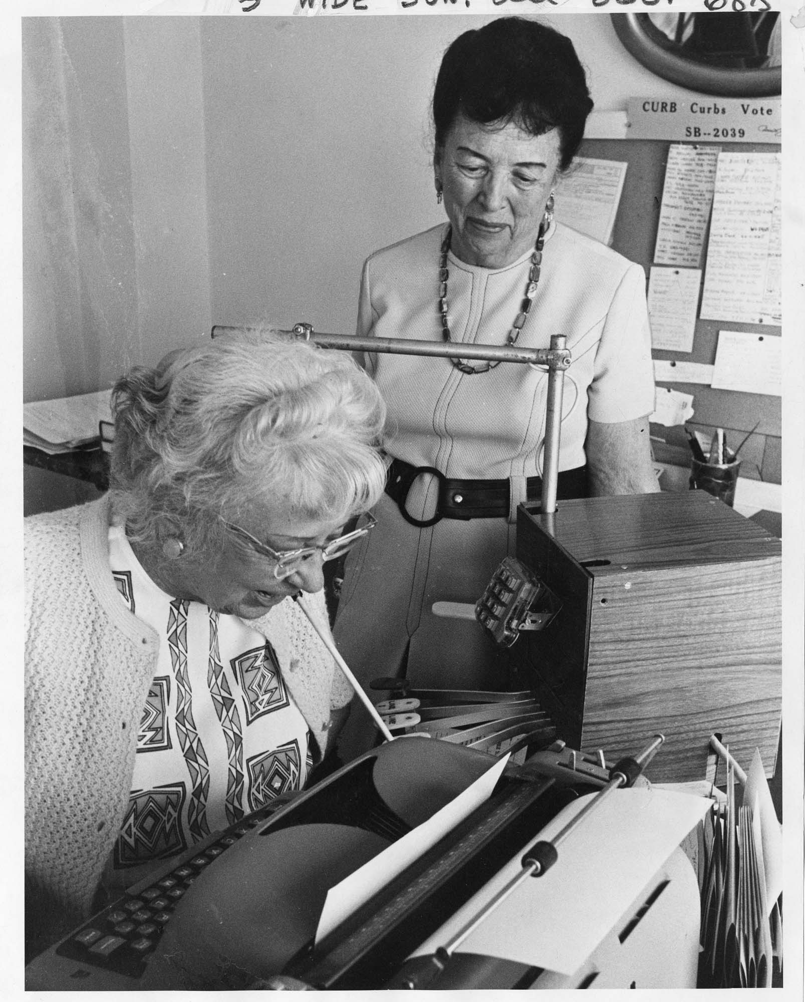 Image of Ida Daly in her office with Hazel Flagler Begeman, Seattle, August 1973
