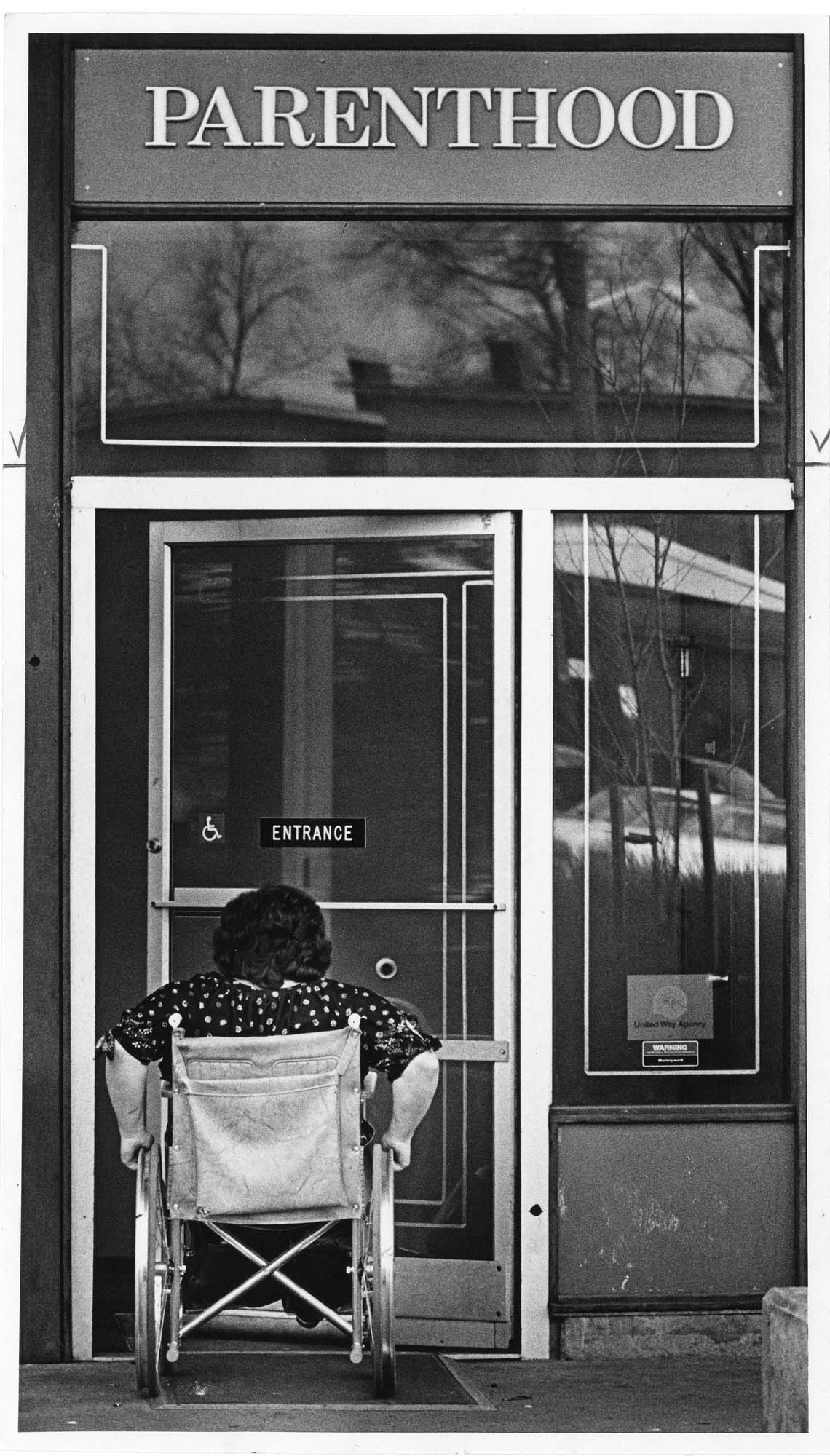 Image of Woman in wheelchair entering a family planning clinic, Seattle, February 1980