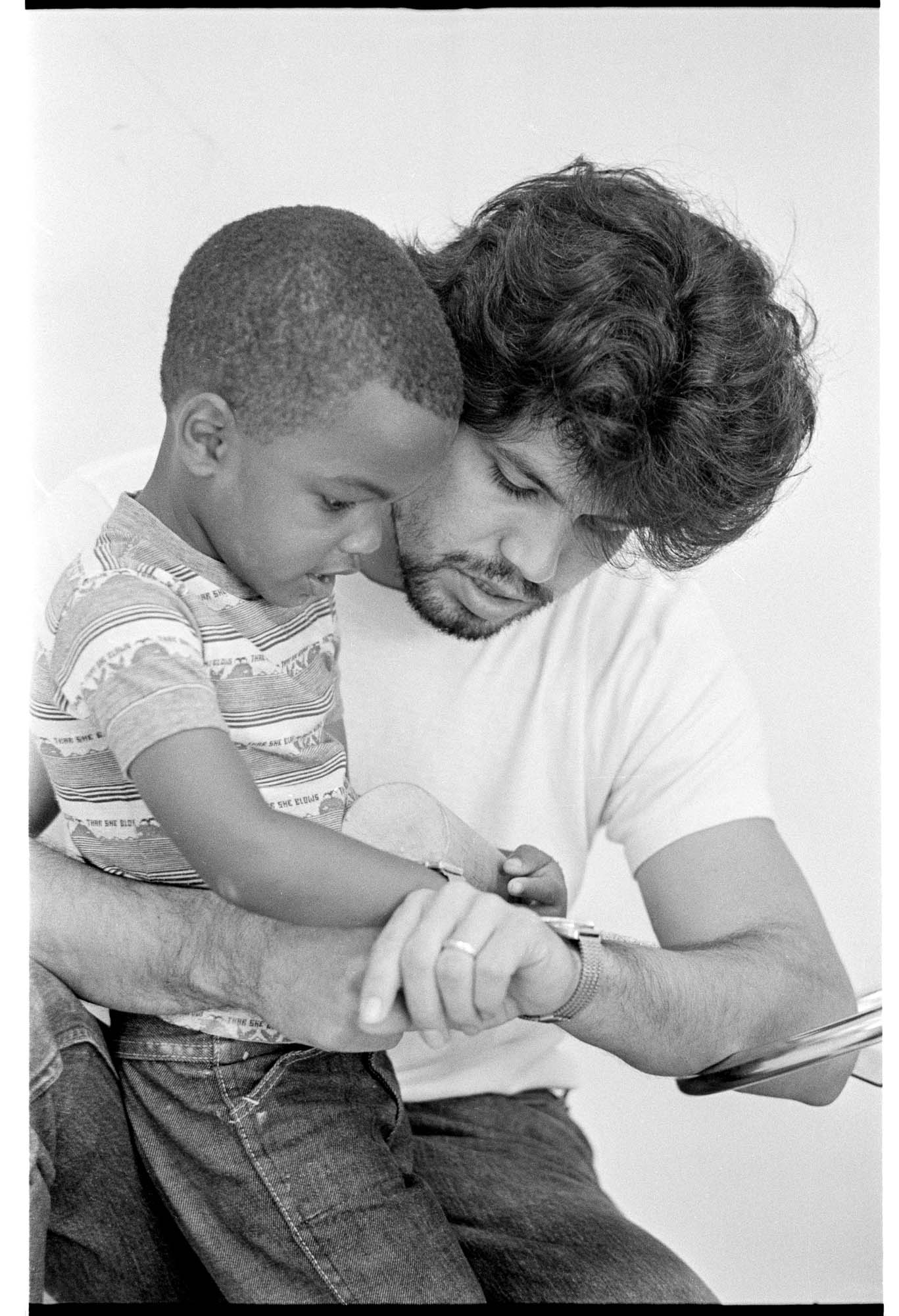 Image of Bobby Richmond with teacher Jack Esparza at El Centro de la Raza's bilingual child care program, Seattle, September 1974
