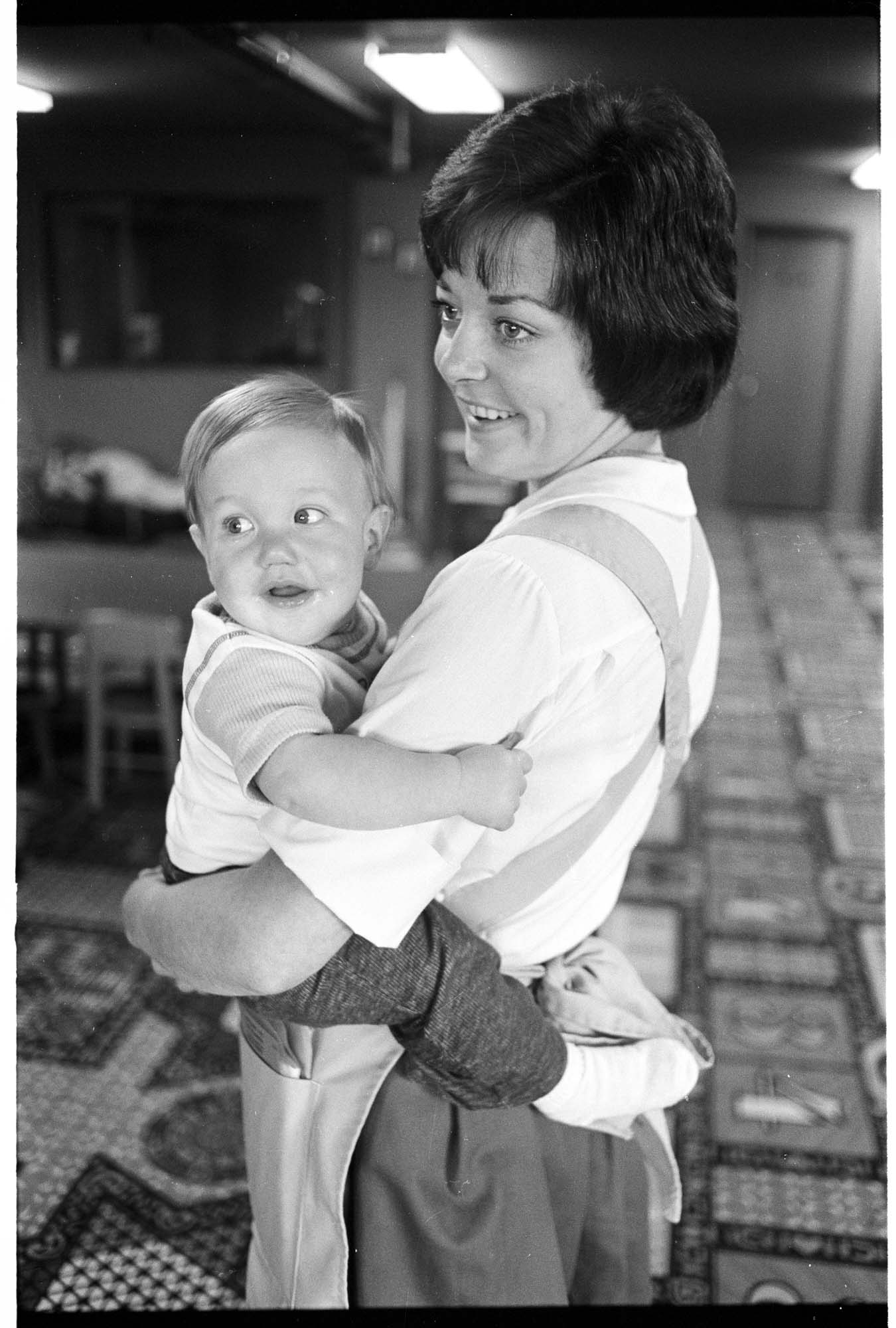 Image of Cindi Grube with her son Bryan at Blazers Broiler daycare, Redmond, May 1976