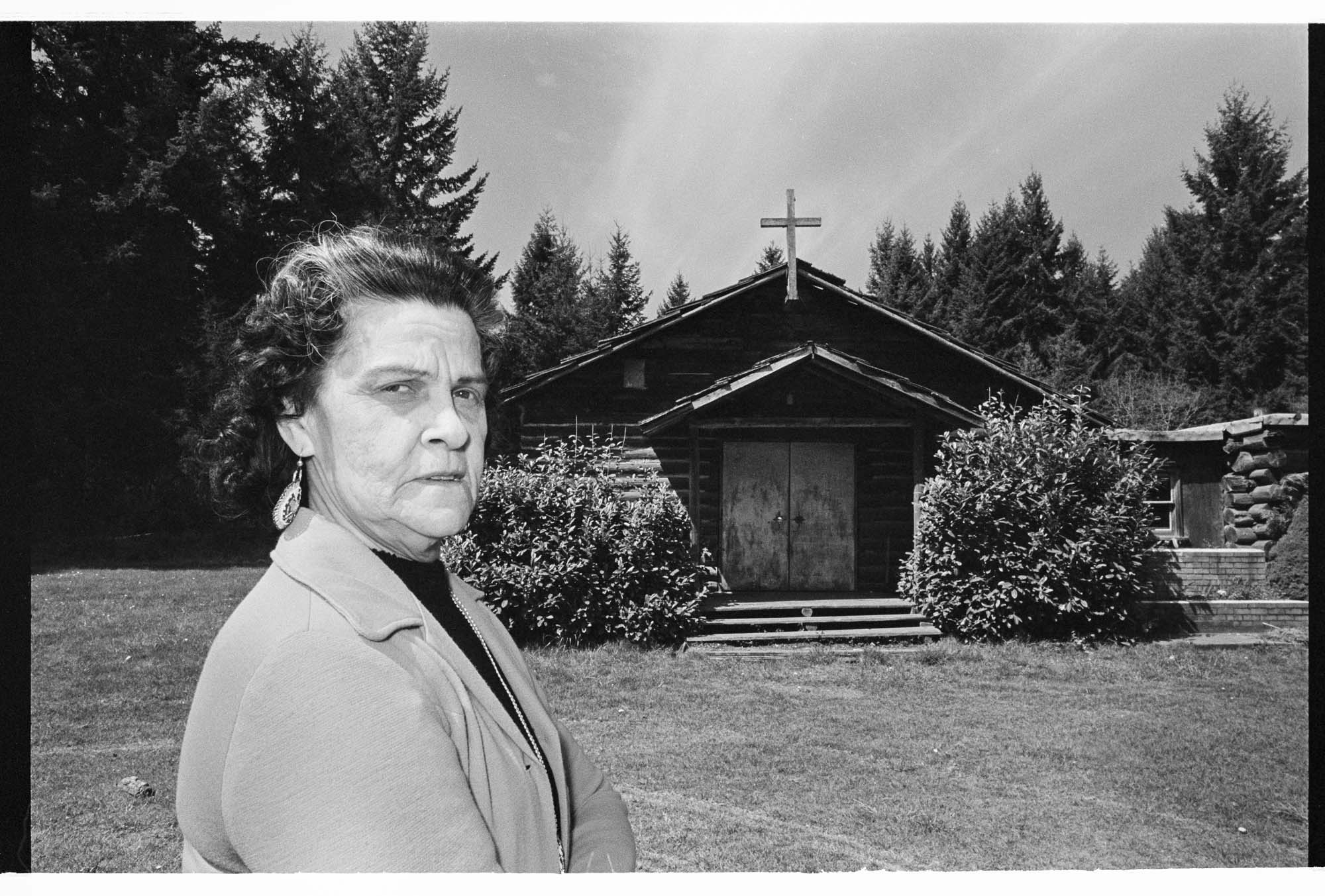 Image of Judge Kathleen Bishop outside the Nisqually Tribe Community Church where she holds court, 1977