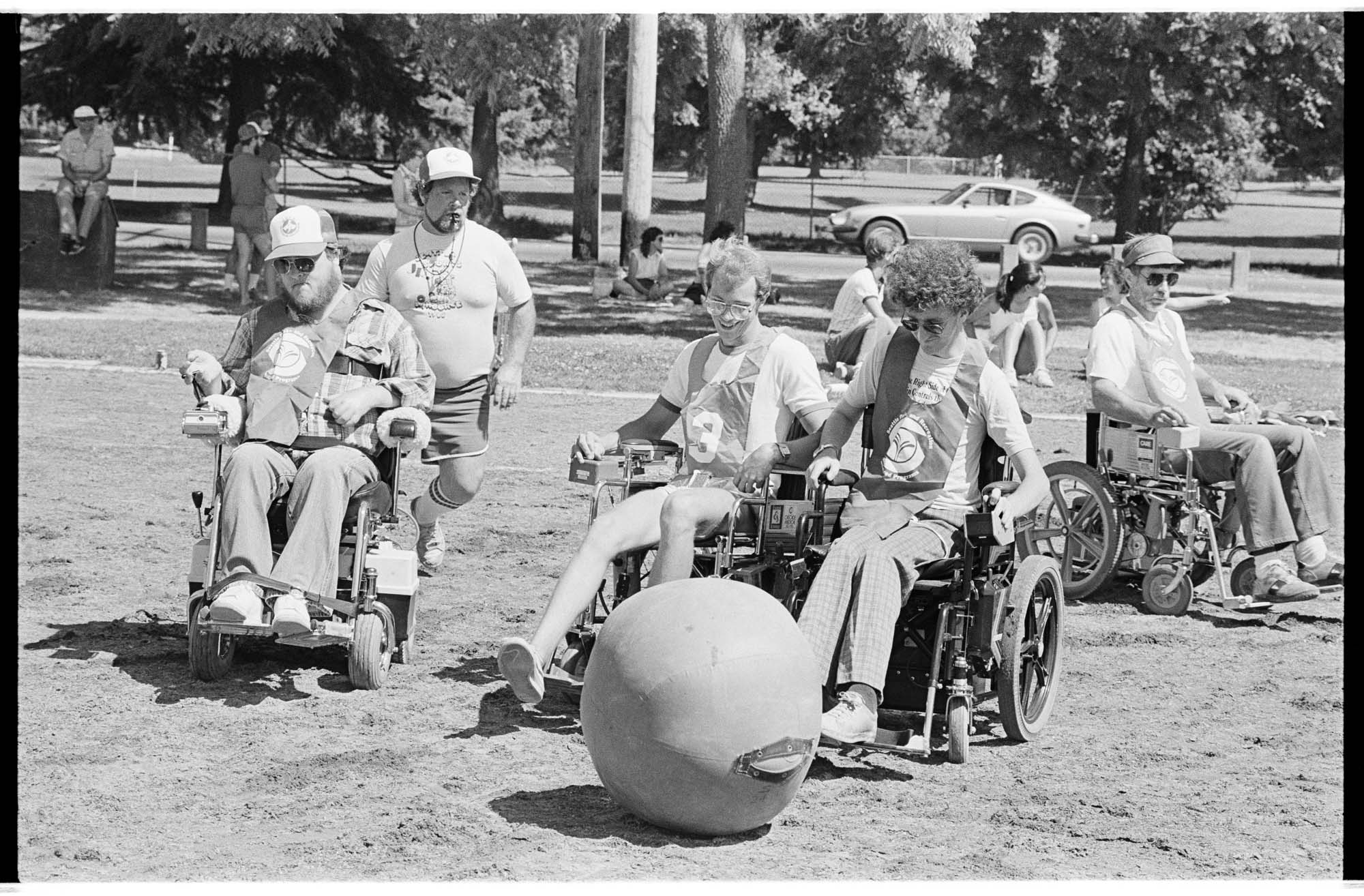 Image of People in motorized wheelchairs playing soccer, Seattle, July 28, 1985​