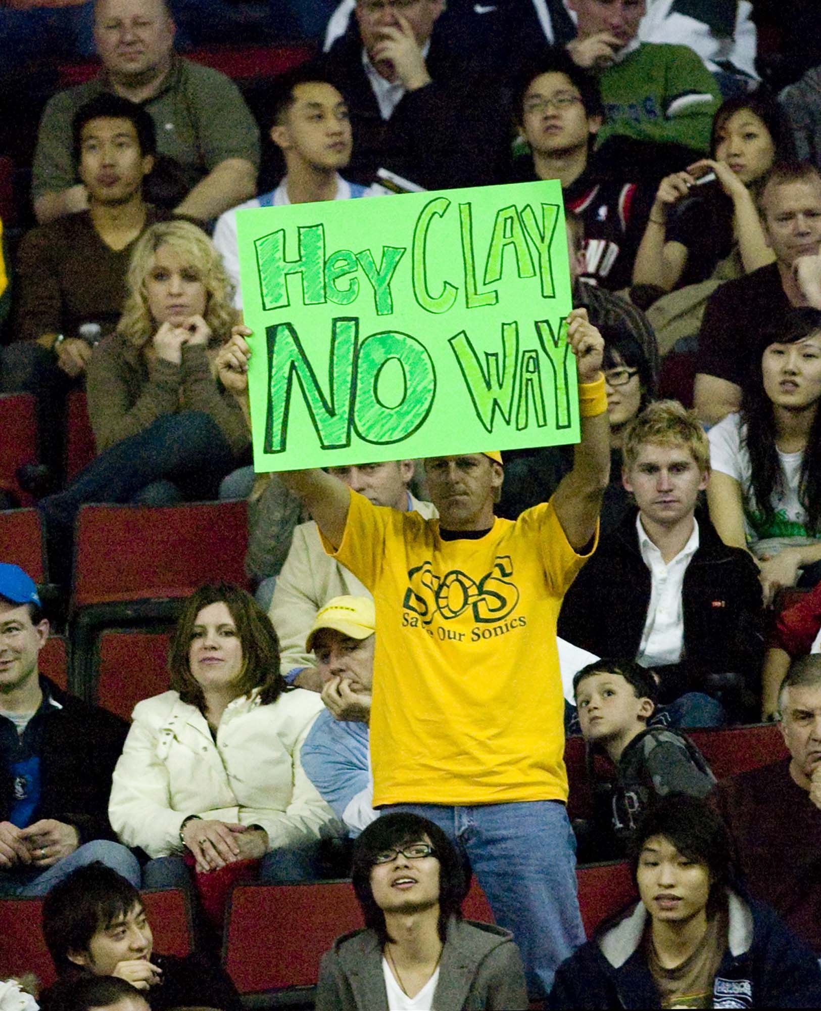 Image of Fan with sign at last Sonics home game before move to Oklahoma, April 13, 2008