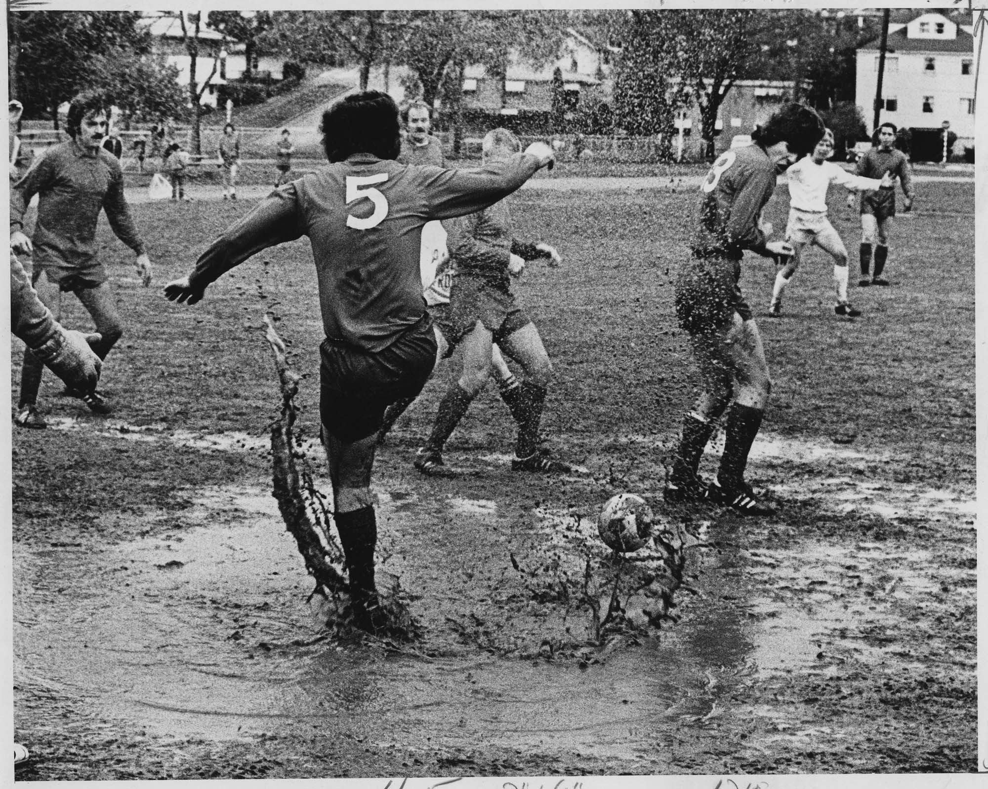 Image of Electrics soccer team playing in the mud at Woodland Park, Seattle,  November 2, 1975