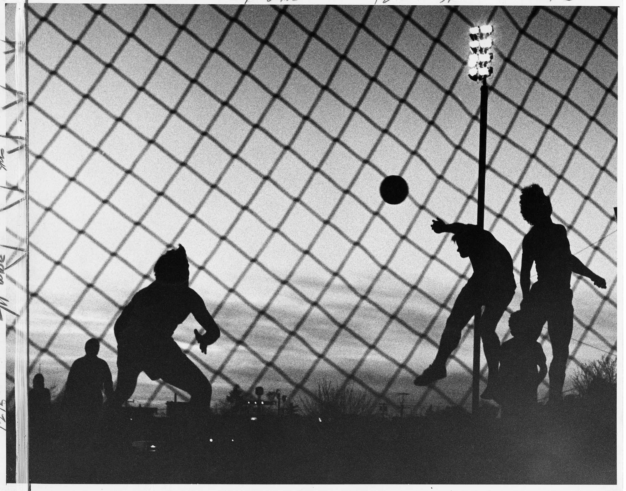 Image of Seattle Sounders and San Jose Earthquakes players in silhouette at Highline Stadium, Burien, April 11, 1975