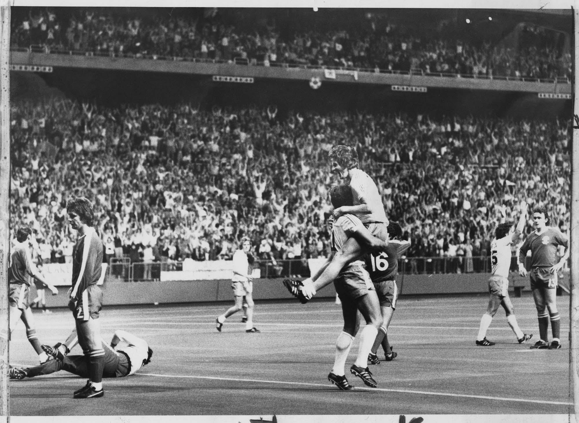 Image of Seattle Sounder Gordon Wallace leaping onto teammate Geoff Hurst after scoring a goal in playoffs, Seattle, August 18, 1976