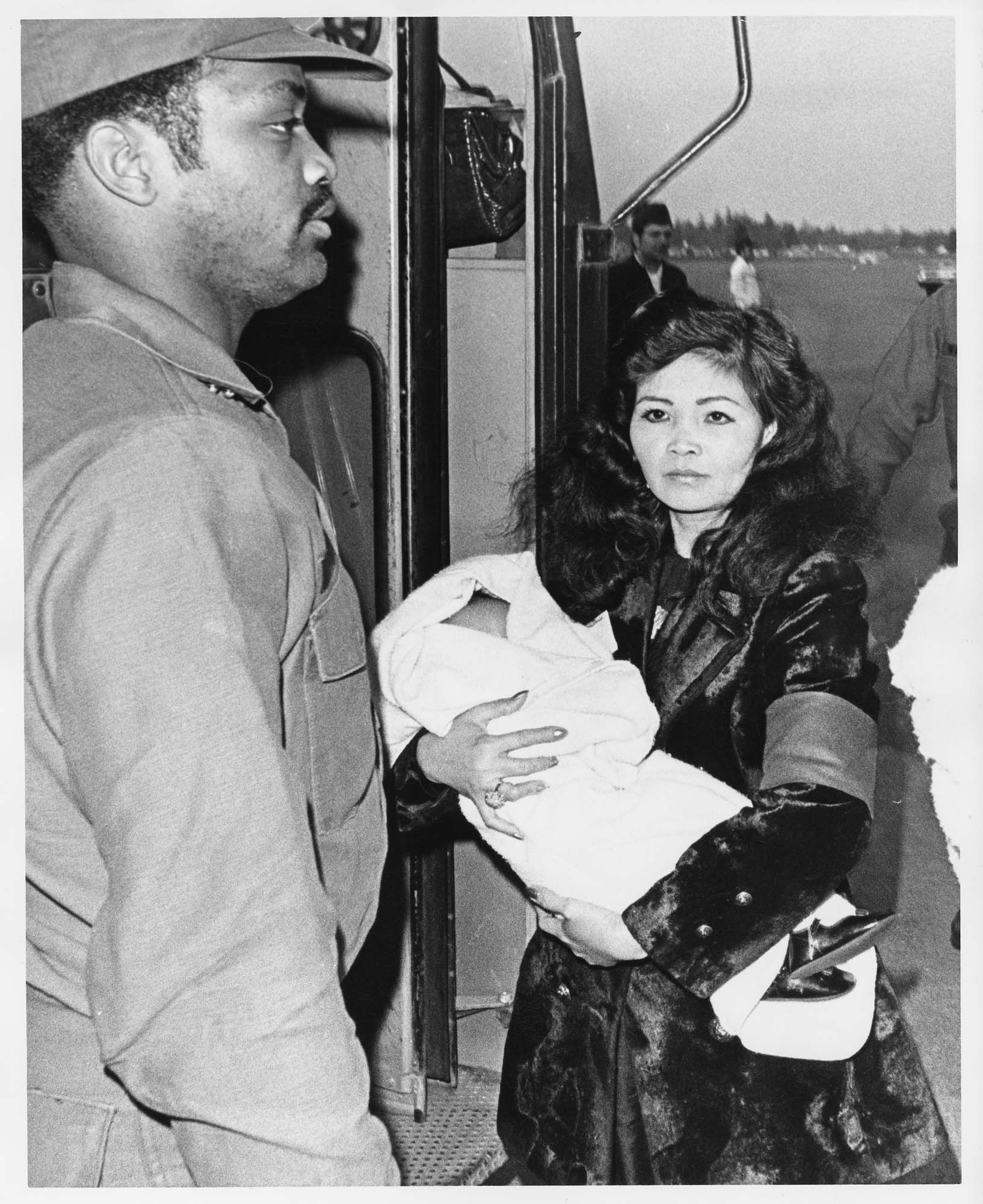 Image of Vietnamese woman and baby at McChord Air Force Base, Pierce County, April 29, 1975