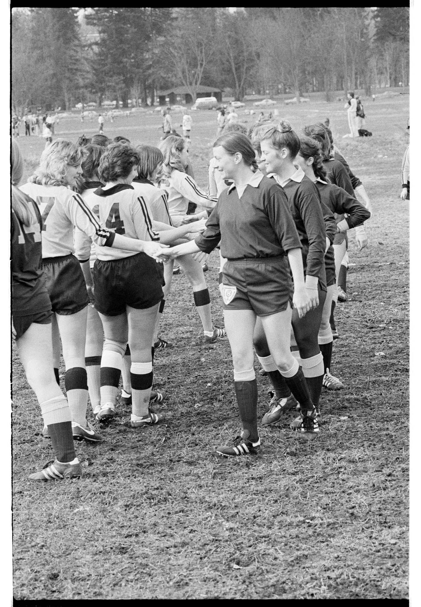 Image of Players shaking hands after a game at the WSWSA women's soccer jamboree at Marymoor Park, Redmond, March 8, 1980