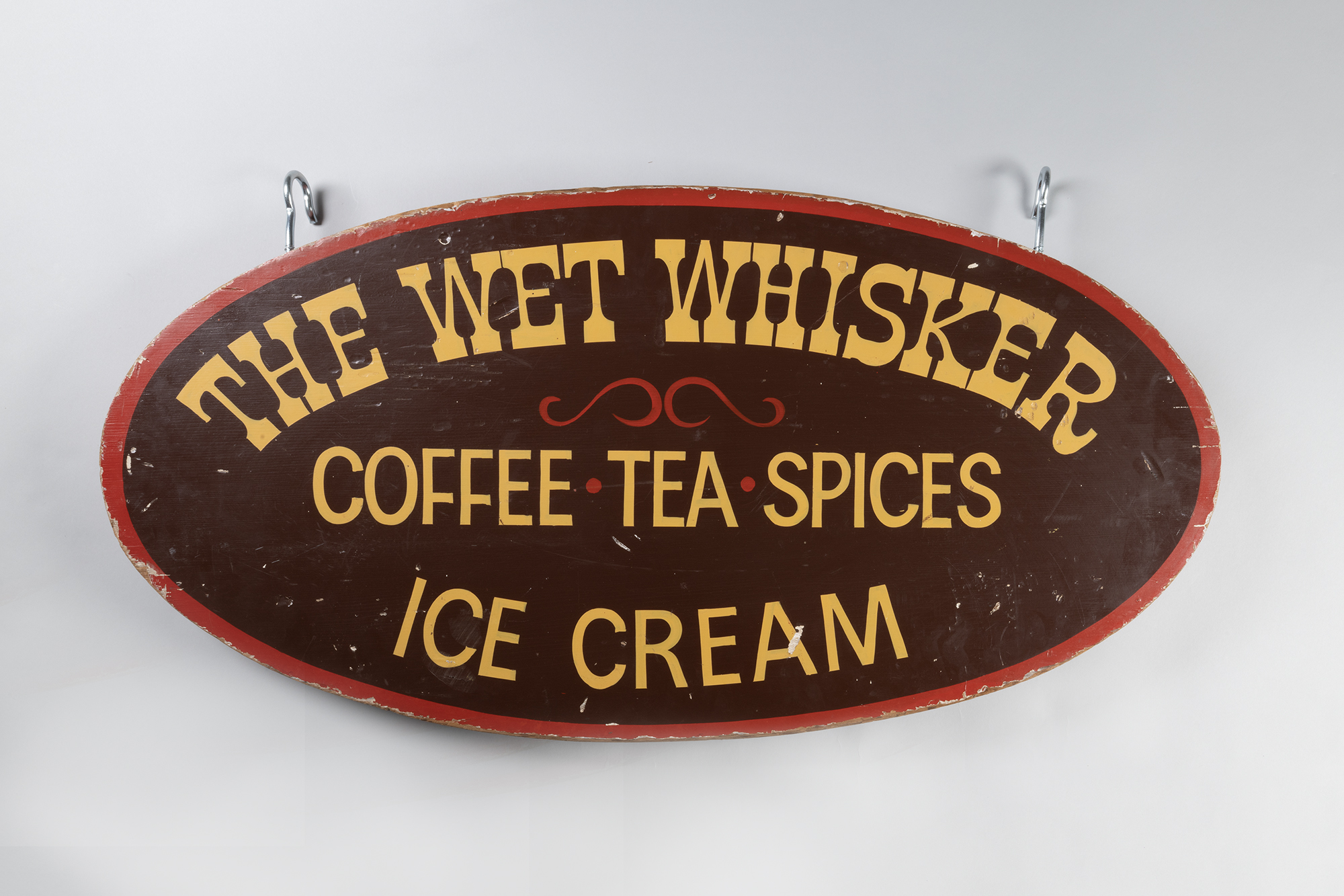 Image of Hanging sign for The Wet Whisker, ca. 1971