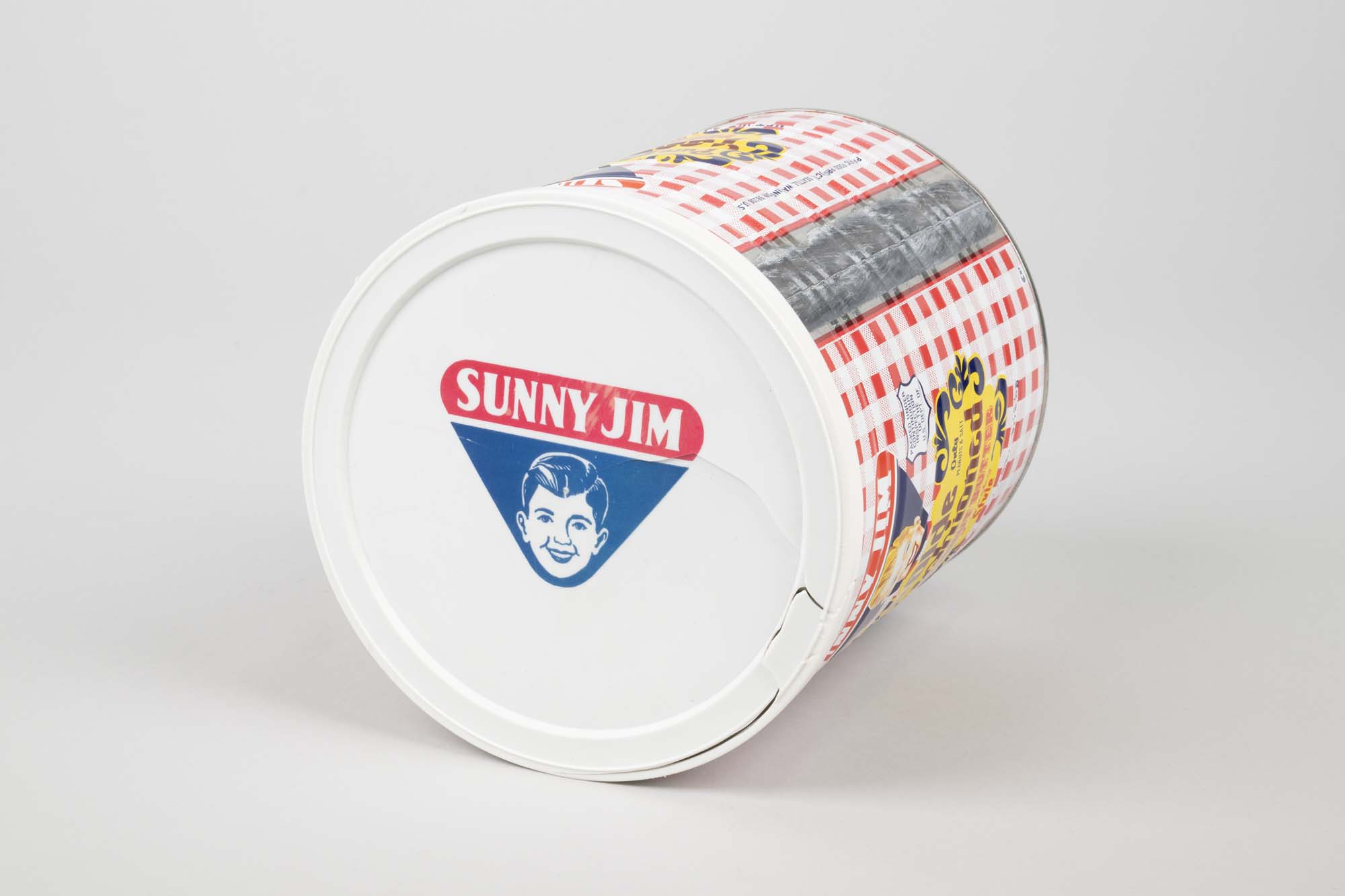Image of Sunny Jim Pure Olde Fashioned Peanut Butter can, ca. 1950s