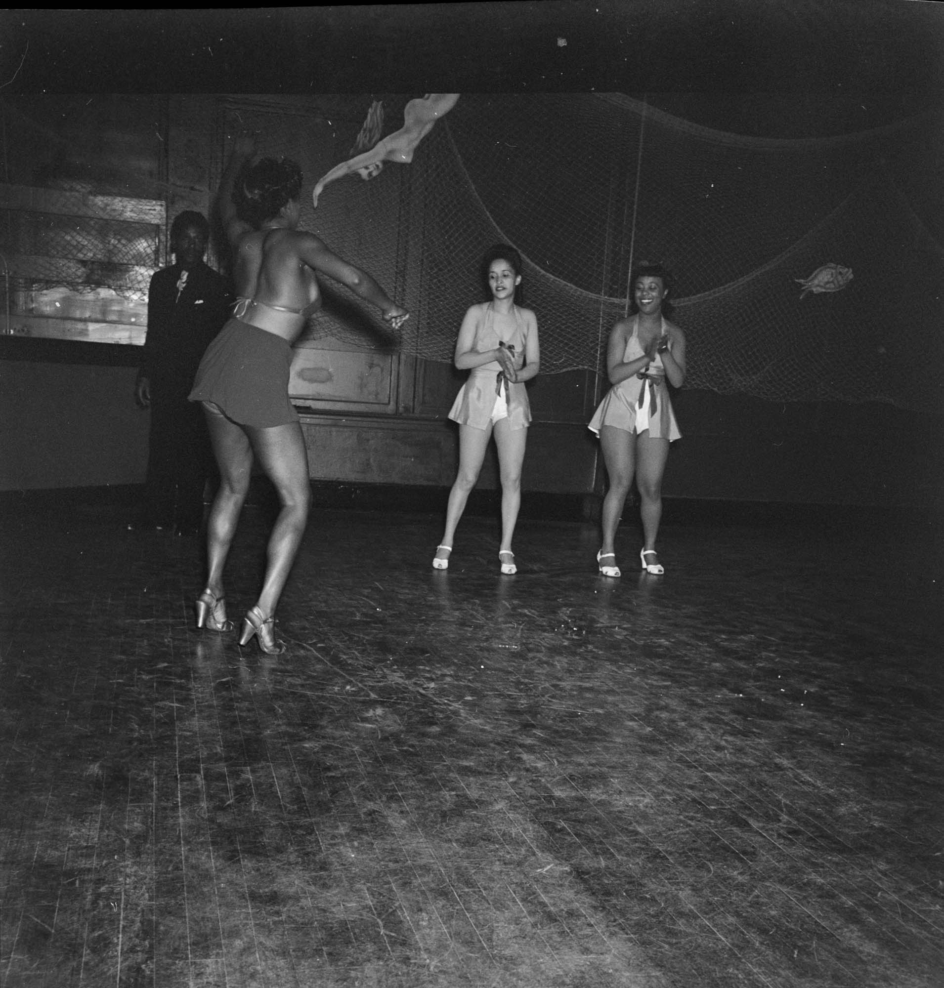 Image of Costumed women dancing, June 22, 1944