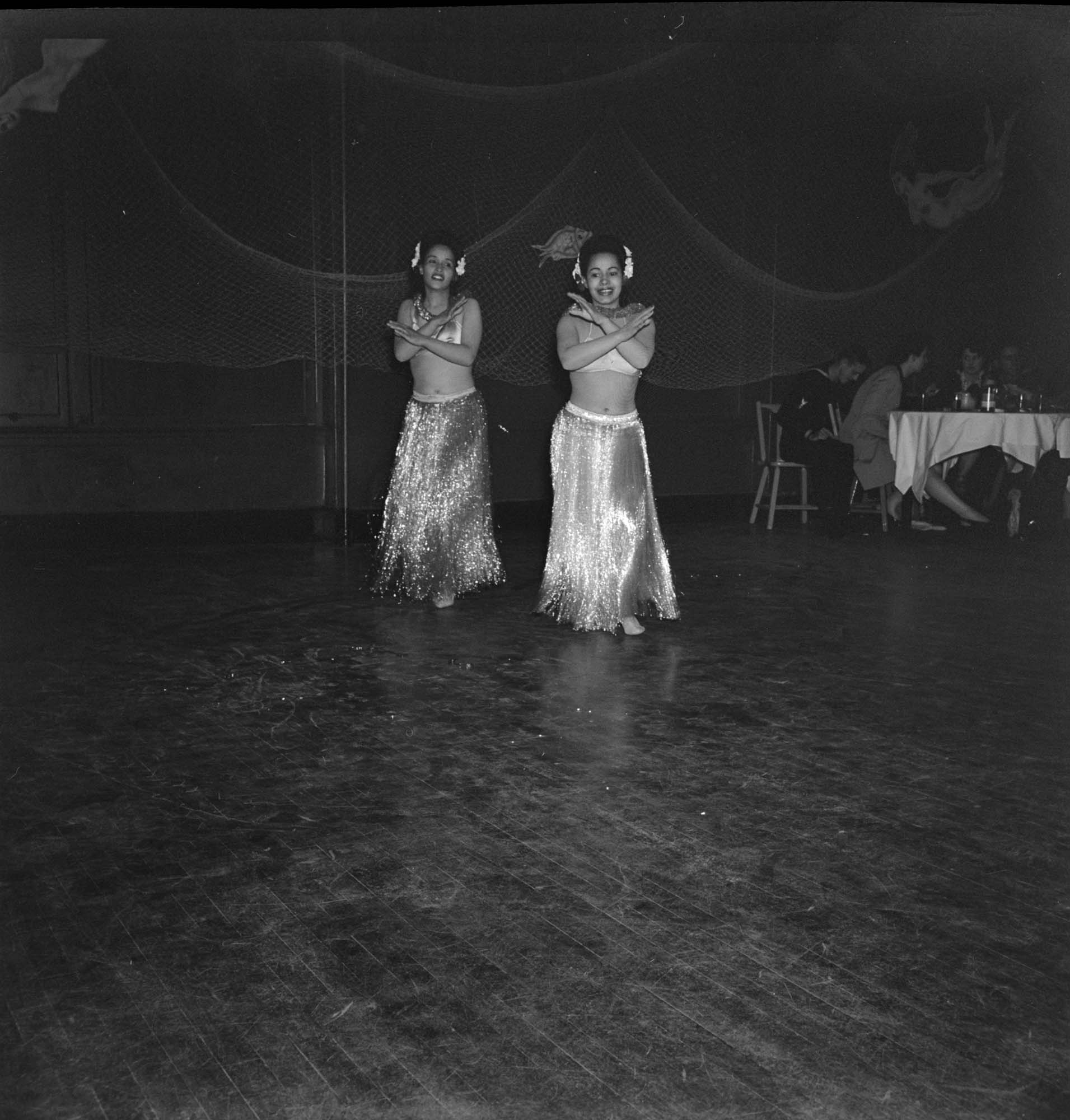 Image of Dancing women in grass skirt costumes, Seattle, June 22, 1944