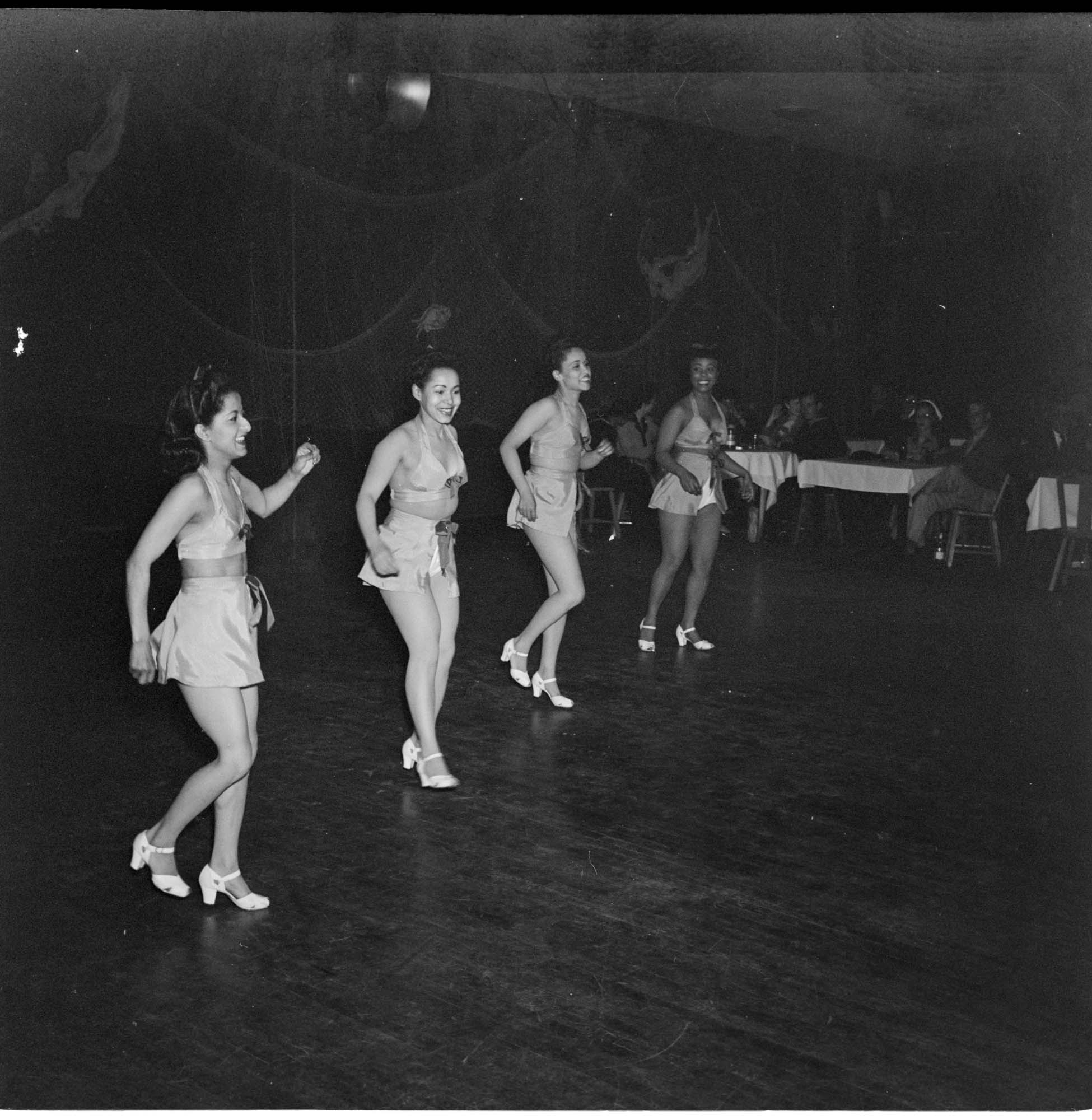 Image of Costumed women dancing, June 22, 1944