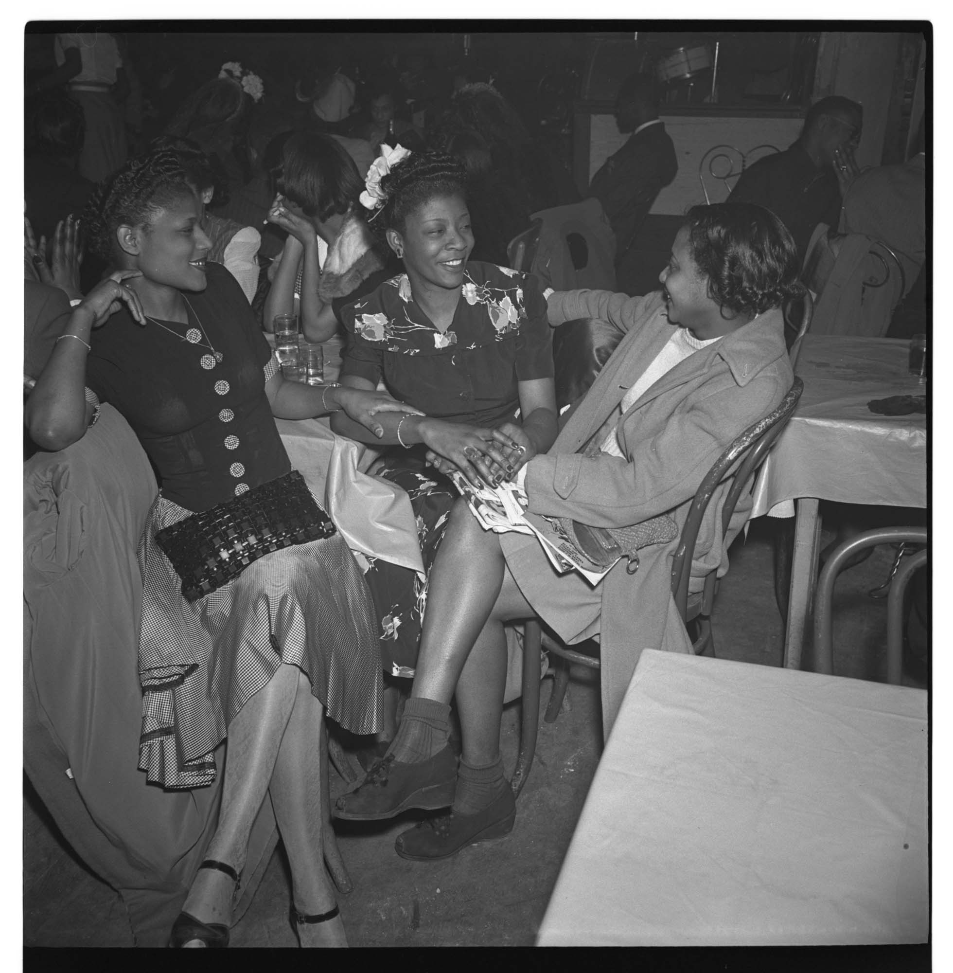 Image of Three women talking at nightclub table, Seattle, circa 1945