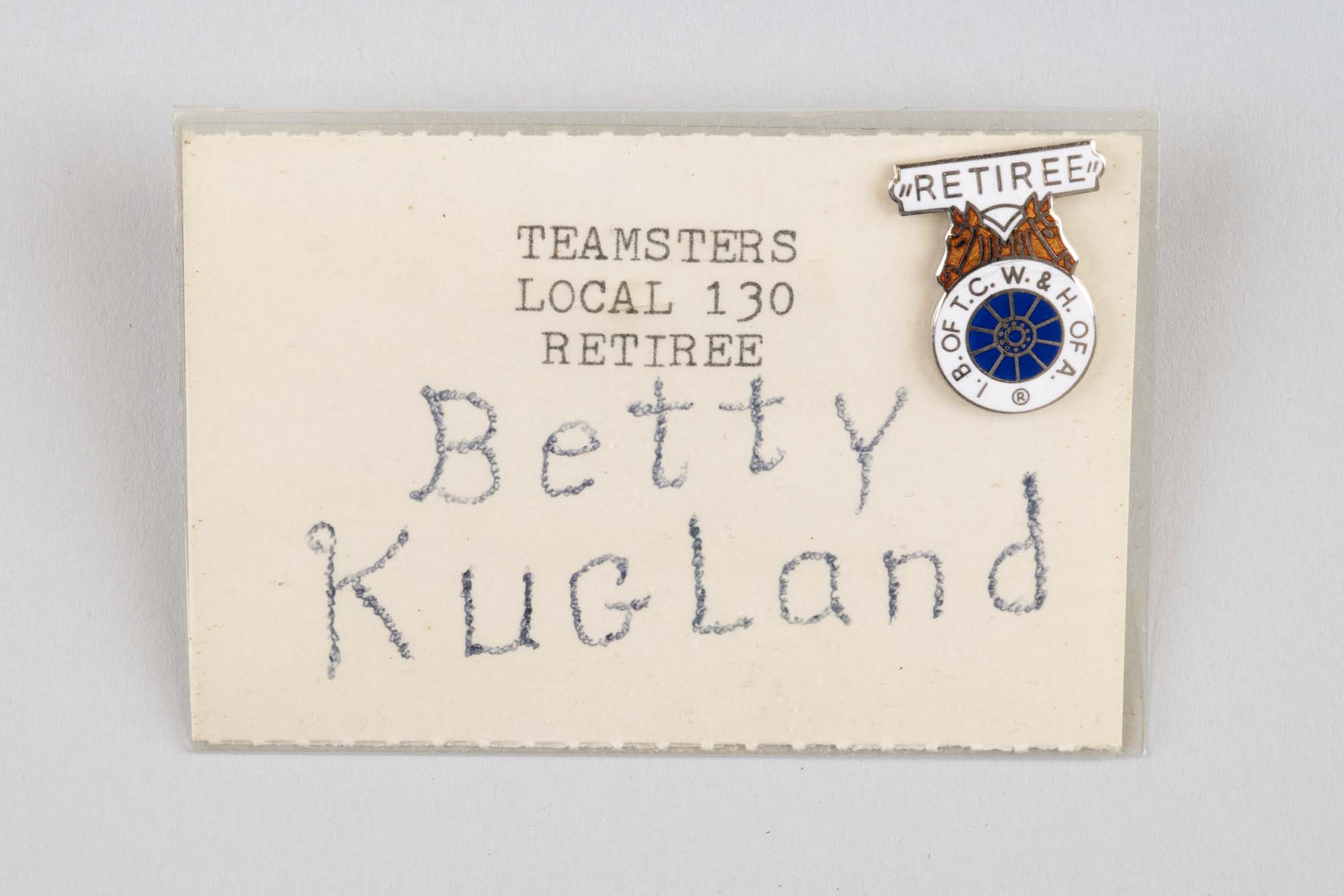 Image of Teamsters nametag for Betty Kugland with pins attached, ca. 1970s-1980s