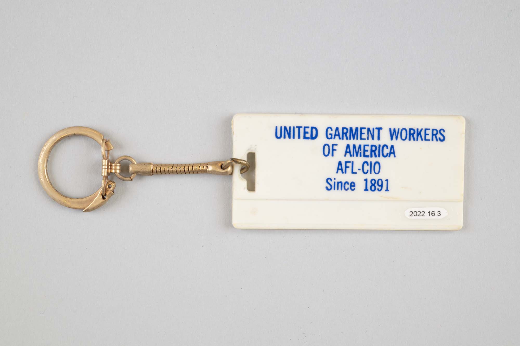 Image of United Garment Workers keychain belonging to Betty Kugland, ca. 1970s-1980s