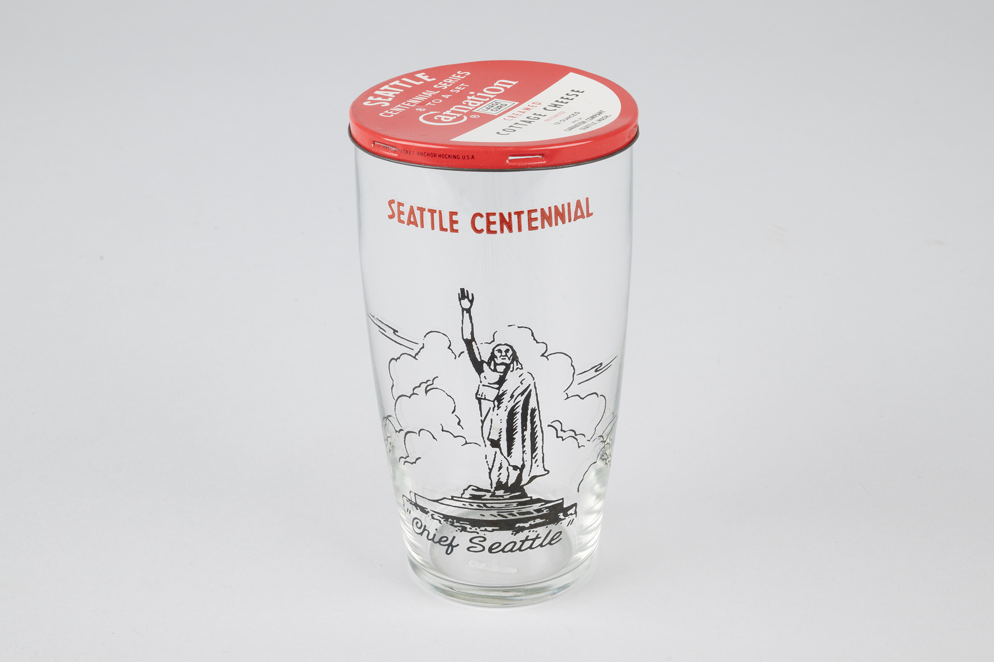 Image of Set of eight Seattle Centennial glasses with Carnation Cottage Cheese tin lids, 1952