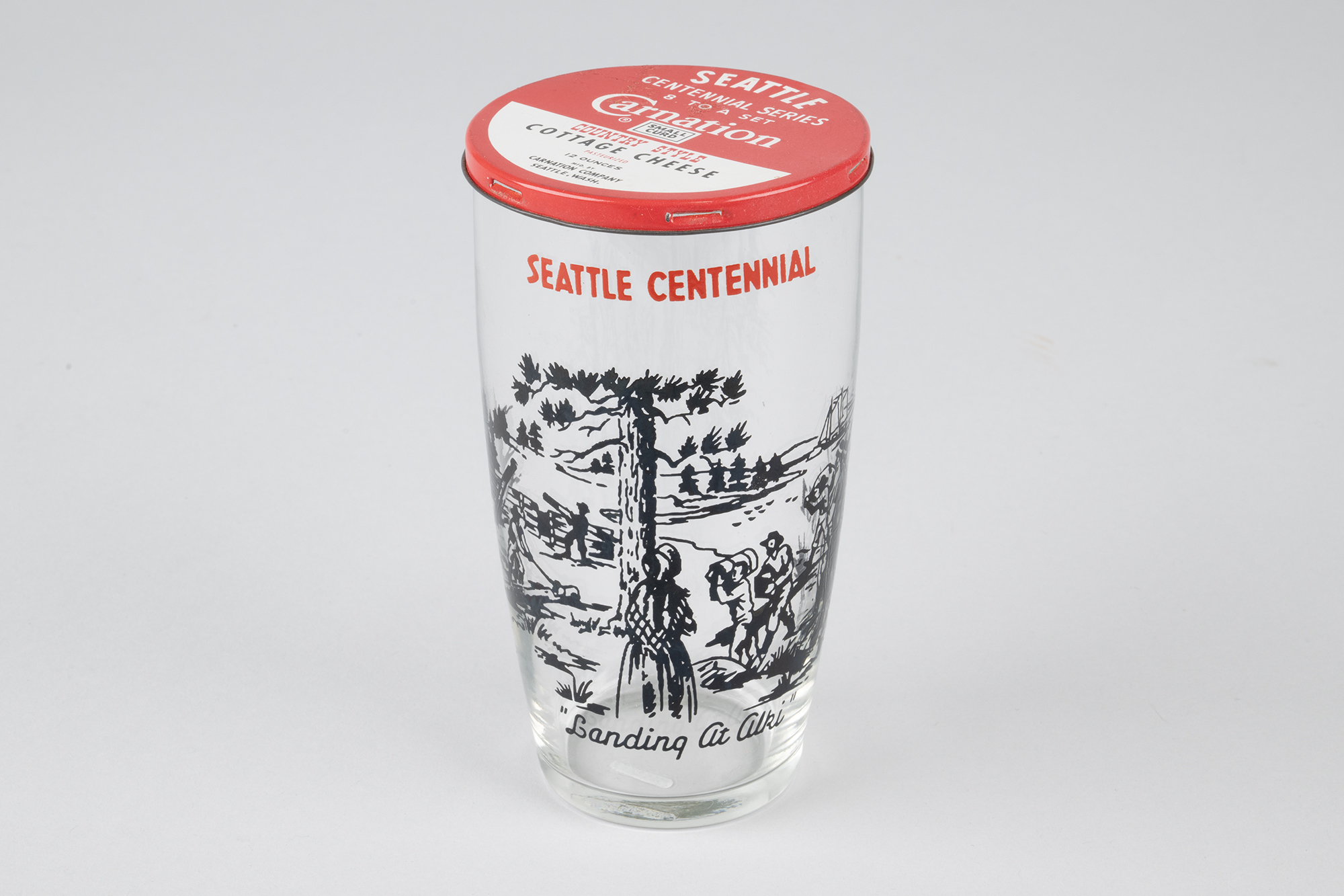 Image of Set of eight Seattle Centennial glasses with Carnation Cottage Cheese tin lids, 1952