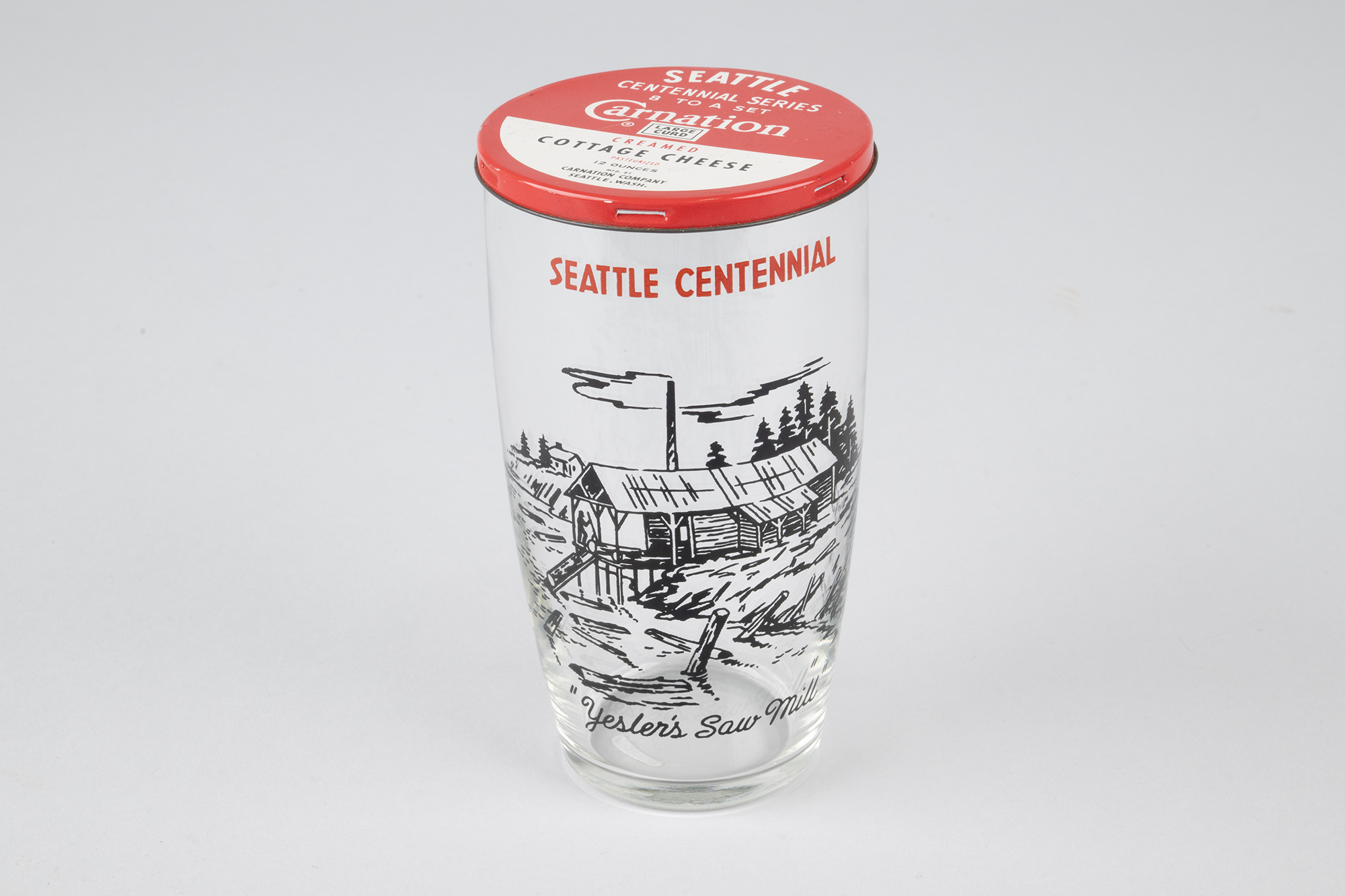 Image of Set of eight Seattle Centennial glasses with Carnation Cottage Cheese tin lids, 1952