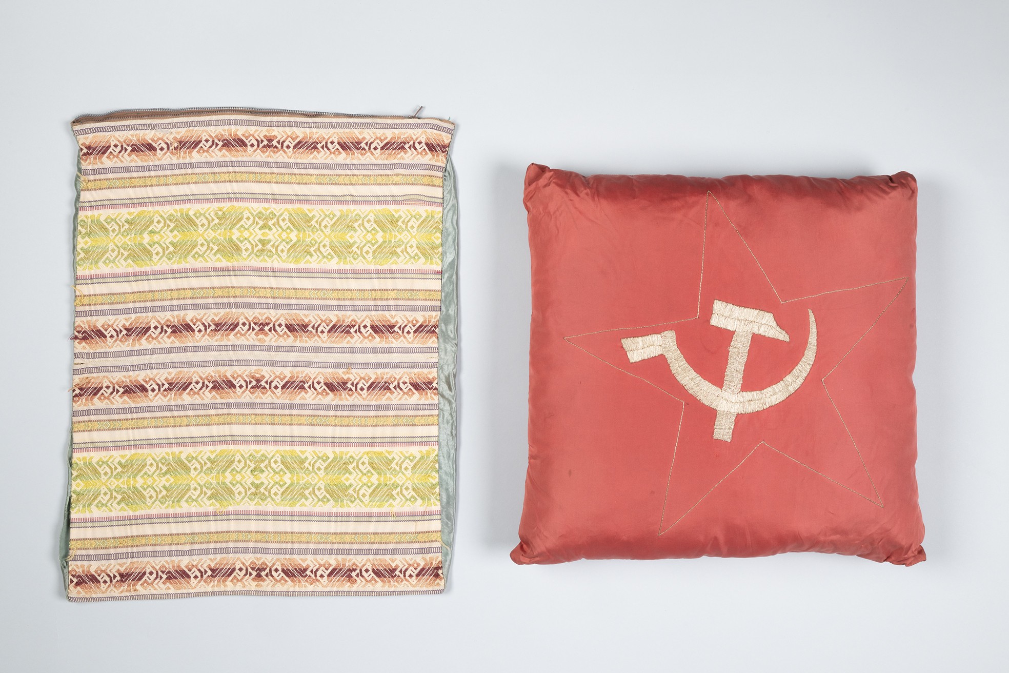 Image of Hammer and sickle cushion with handwoven cover from Lithuania, ca. 1961