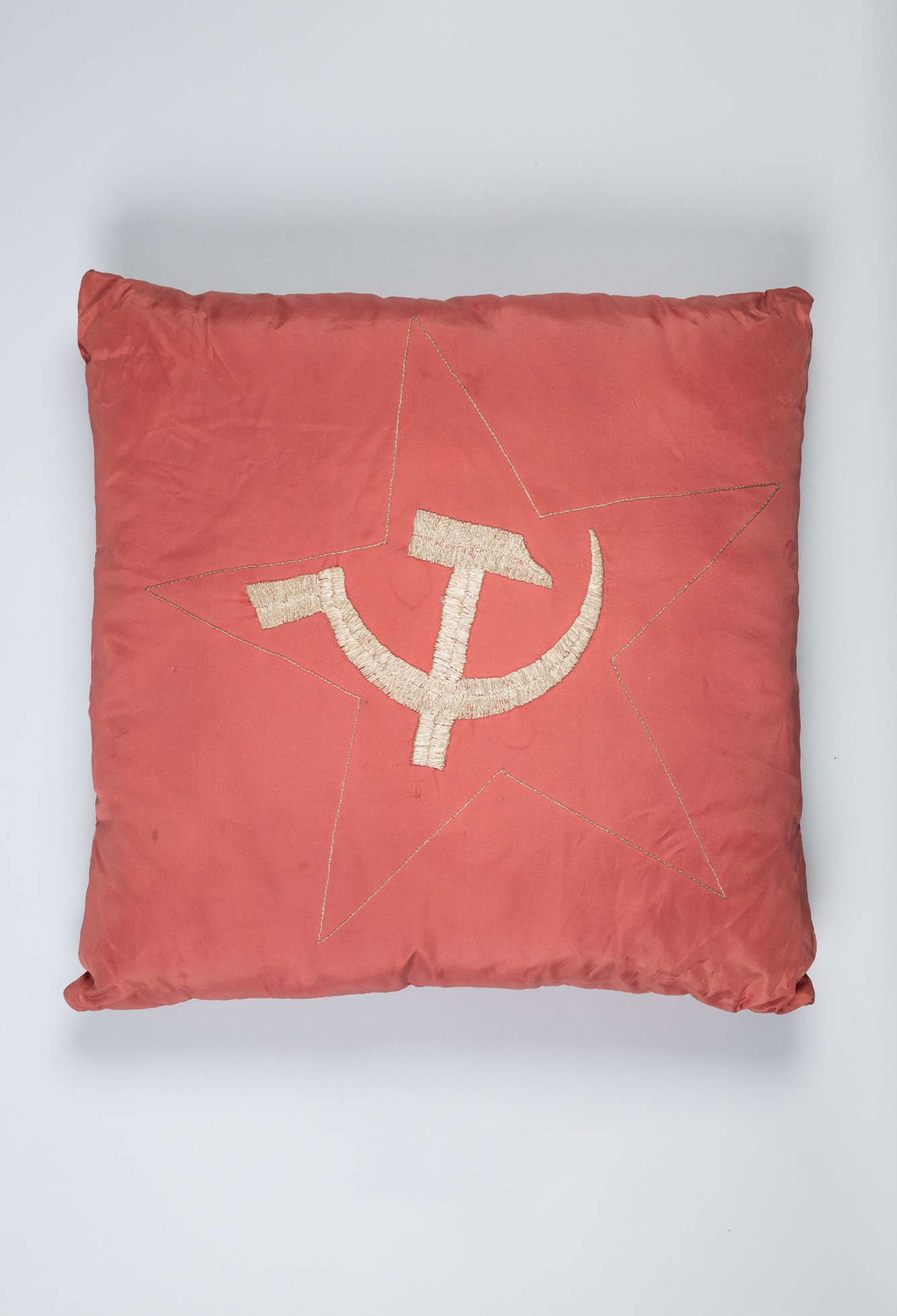 Image of Hammer and sickle cushion with handwoven cover from Lithuania, ca. 1961