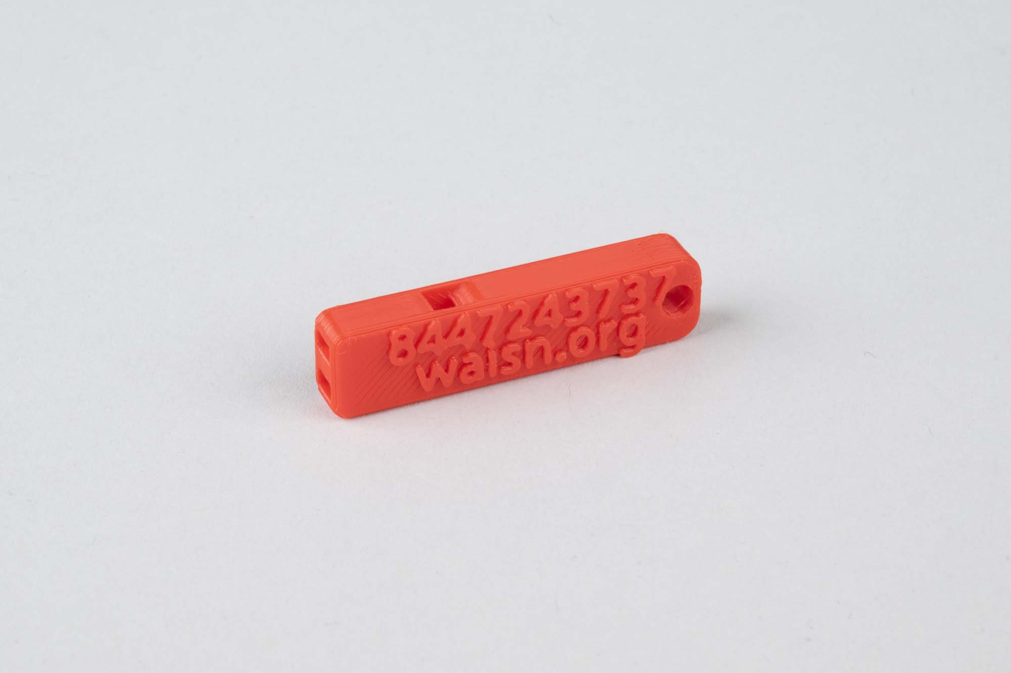 Image of Red whistle and instruction booklet for alerting neighbors to ICE activity, 2026