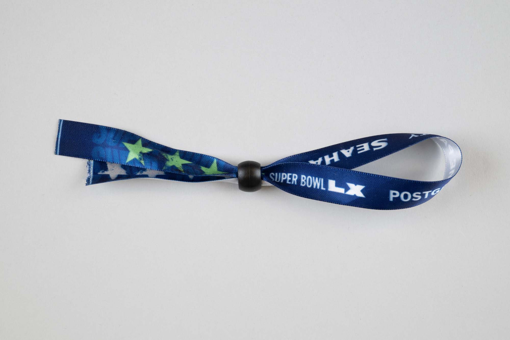 Image of Super Bowl LX fabric Post Game Party bracelet for member of the Seattle Seahawks Ring of Honor club, 2026