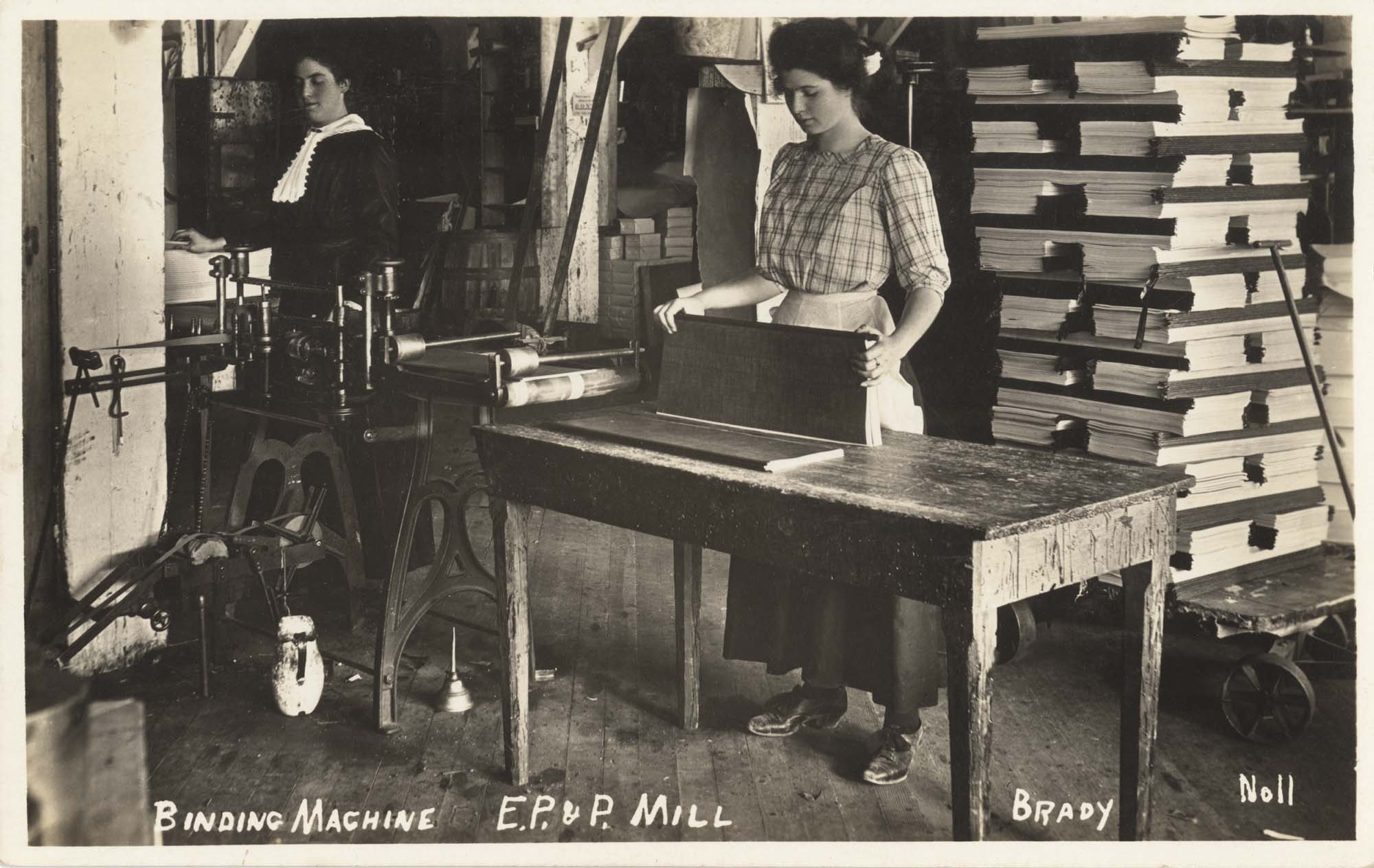Image of Women working at a binding machine in Everett, circa 1915