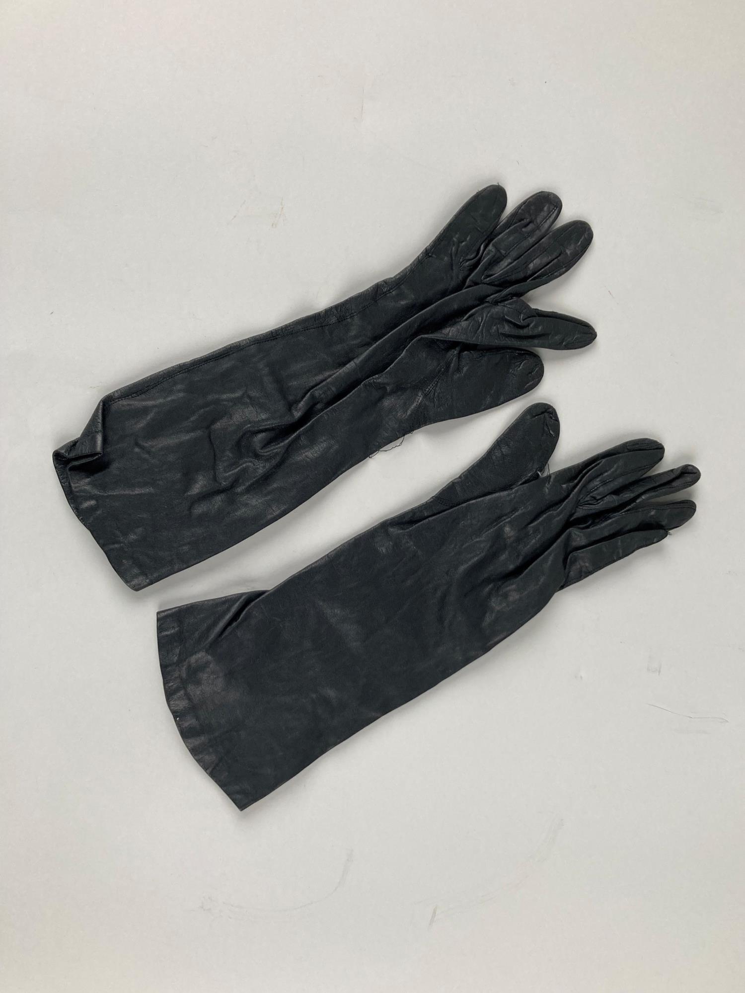 Image of Black gloves, worn with black dress ensemble, 1961
