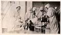Image of Nurses and doctors during a surgery at Minor Private Hospital, circa 1920