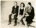 Image of Helene Madison sitting with coach Ray Daughters and her mother at the Moore Hotel pool, circa 1929