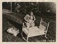 Image of Margaret Levald Jensen with doll and cradle, Seattle, October 28, 1923