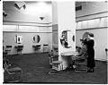 Image of Saleswoman assisting customer at Best's Apparel millinery salon, Seattle, circa 1930