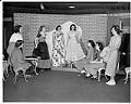 Image of Saleswomen displaying garments at Best's Apparel, Seattle, circa 1940
