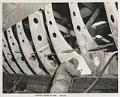 Image of Associated Shipbuilding employee spot welding plates to ribs, Seattle, September 12, 1941
