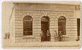Image of Arthur and Rolland Denny standing in front of the Dexter Horton Bank, Seattle, circa 1880
