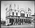 Image of Photographers posing in front of the Photographic Building at the Alaska-Yukon-Pacific Exposition, 1909